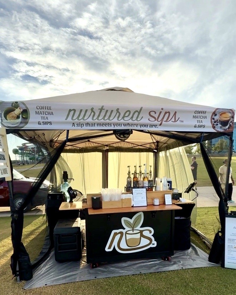 Nurtured Sips mobile coffee cart serving handcrafted coffee, matcha, and lemonade at an outdoor event in the Dallas-Fort Worth area.