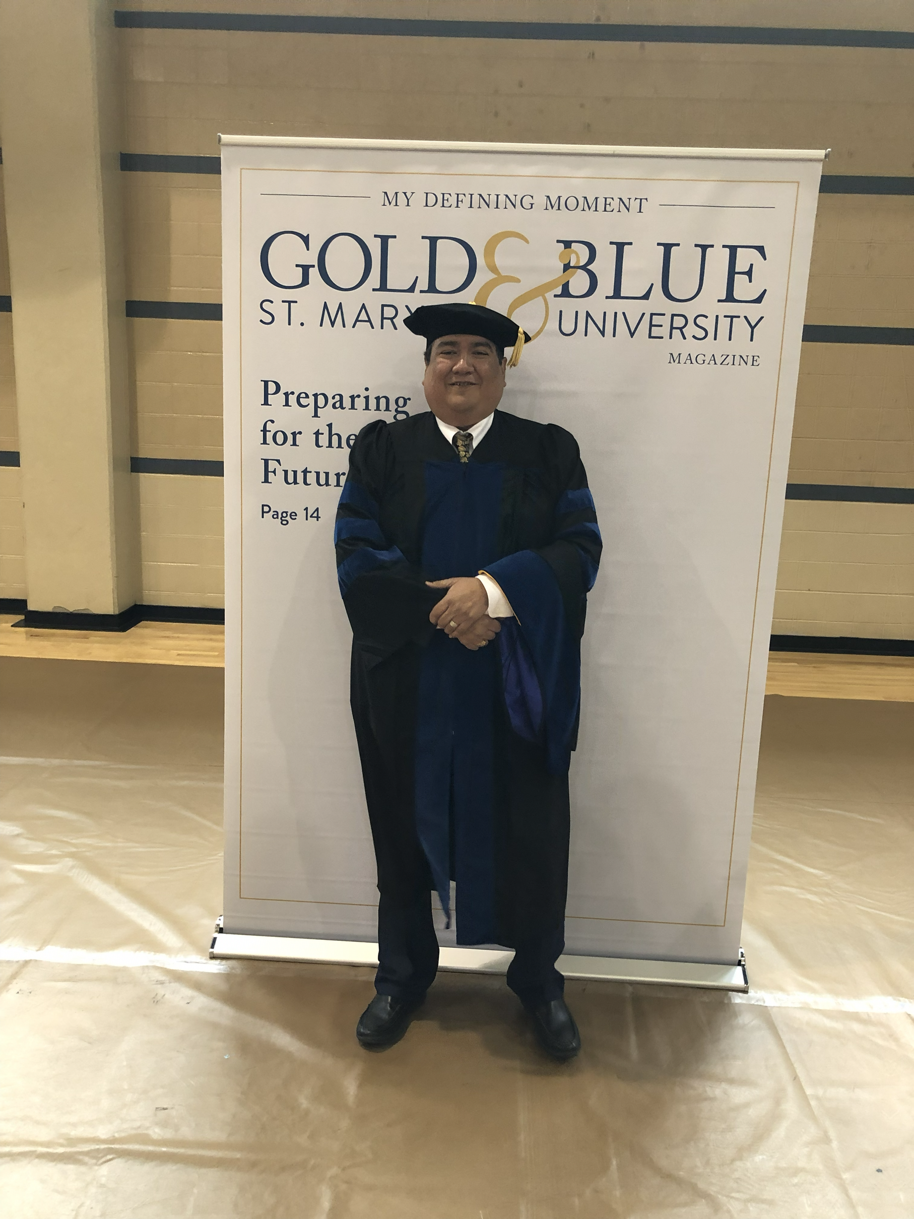 Gustavo waiting for the graduation procession at St. Mary's University