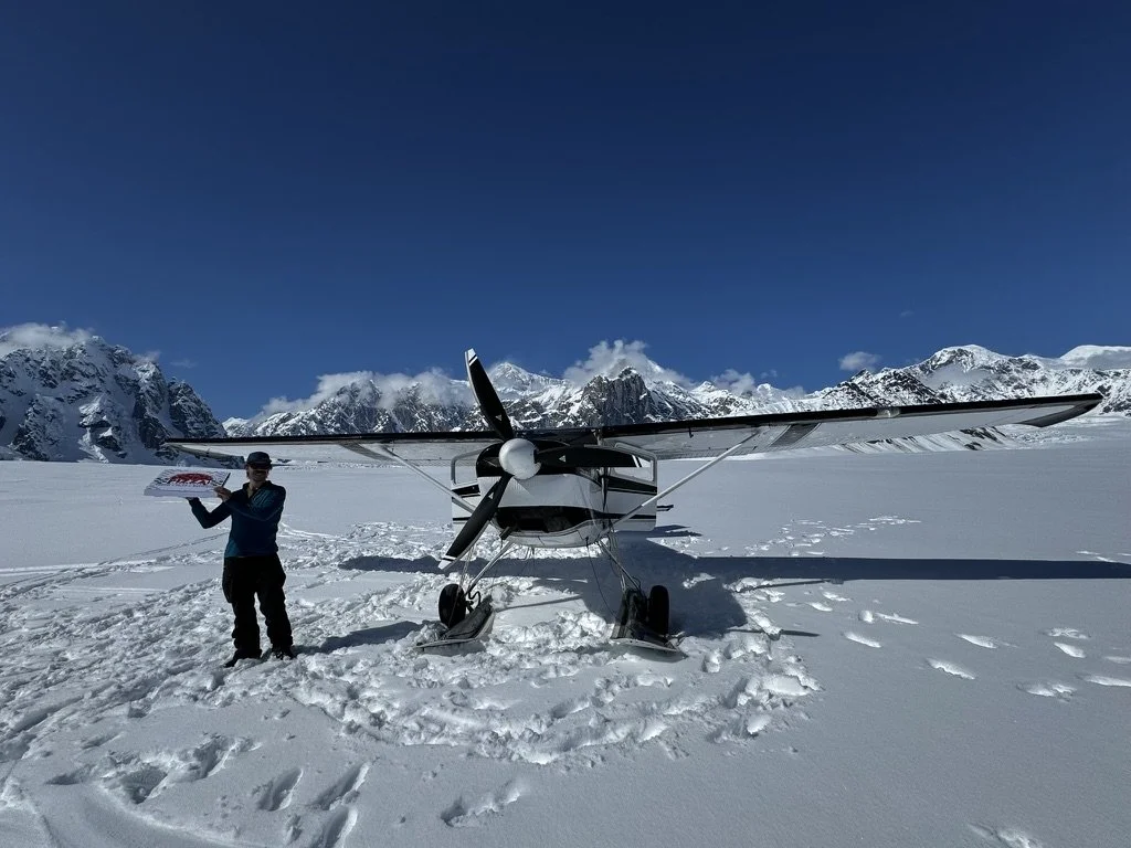 Cessna 180 ski plane pizza delivery to the Ruth Glacier, Denali National Park, Alaska