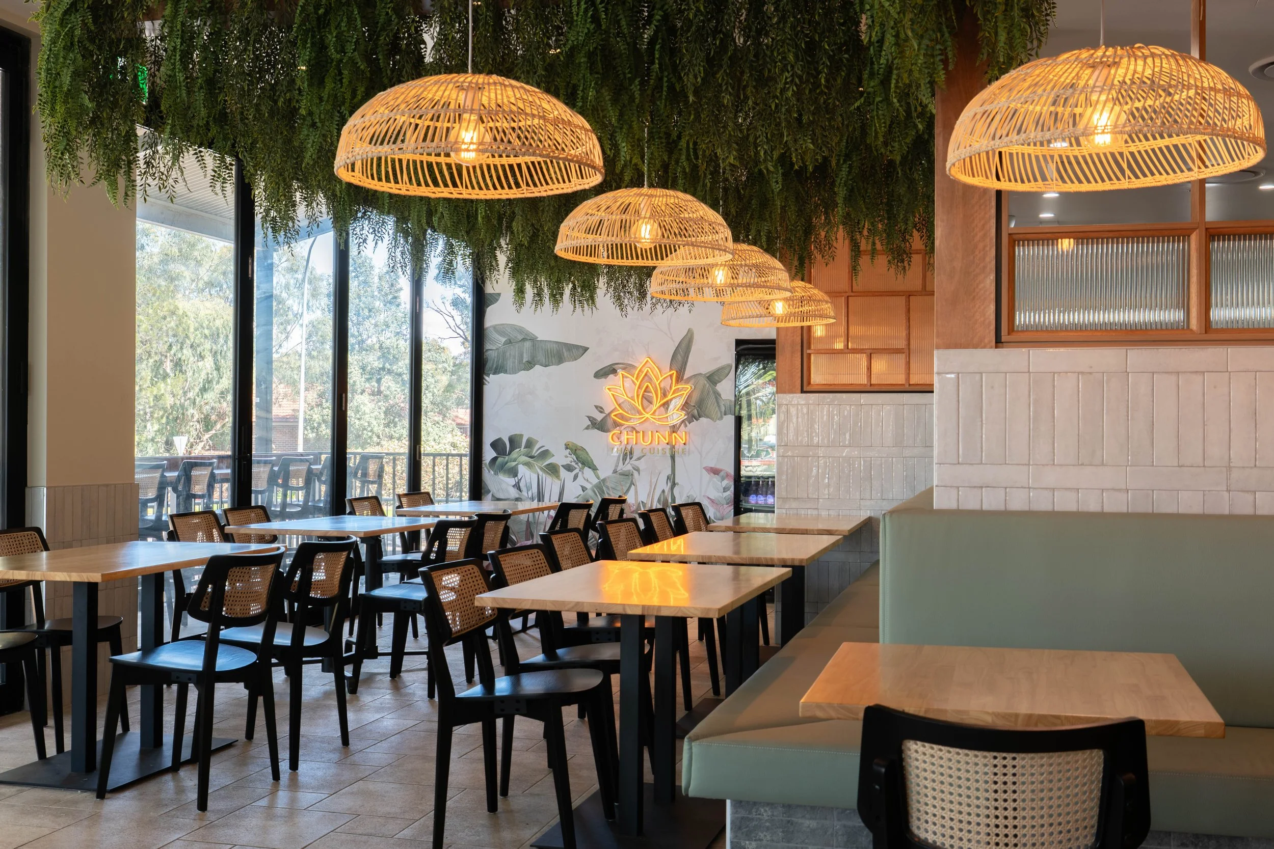 Completed Chunn Thai Menai restaurant fit-out showcasing the dining environment, custom seating, feature lighting and considered interior design details.