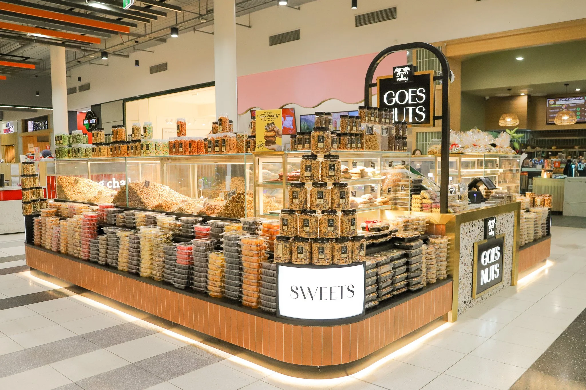 Green Valley Goes Nuts Lidcombe retail fit-out featuring a custom terrazzo counter, integrated signage and a considered specialty food kiosk design.