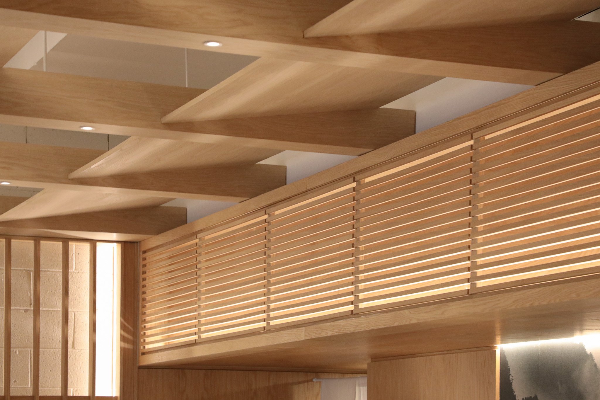 Wonder Sushi Norwest hospitality fit-out featuring a completed timber feature ceiling, bulkhead design and wall battens with detailed craftsmanship and warm material finishes.
