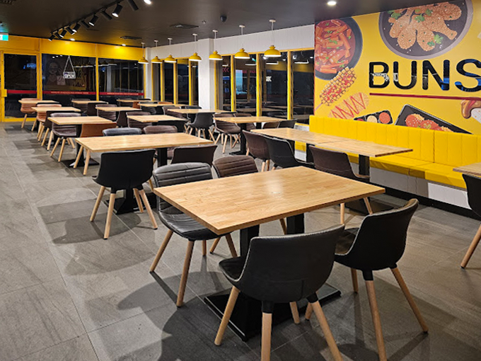 Completed Bunsik Griffith restaurant interior showcasing the dining area, branded graphics and contemporary hospitality fit-out.