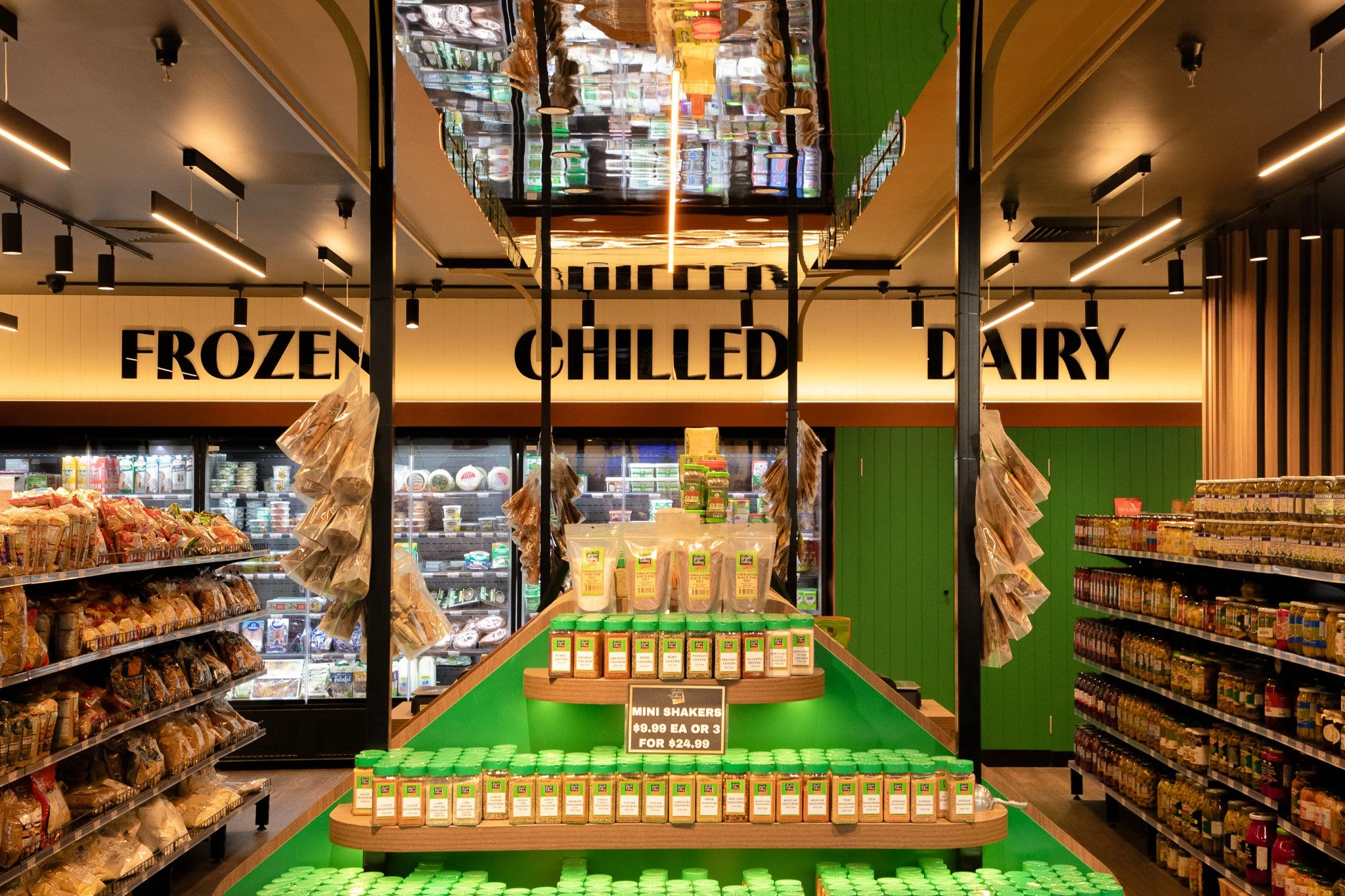 Completed supermarket aisles with custom shelving and organised product displays.