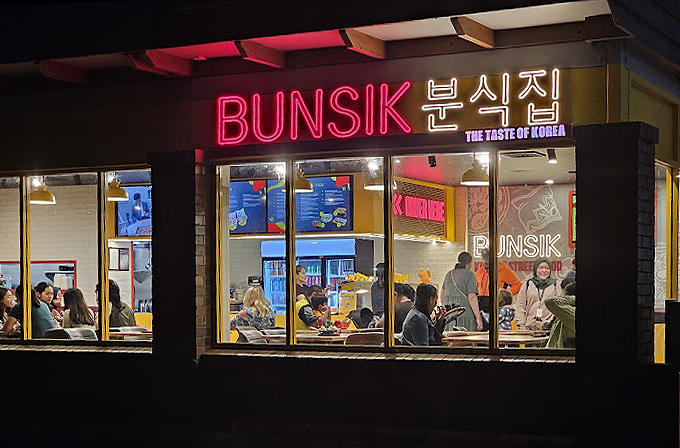 Completed Bunsik Griffith restaurant fit-out showcasing the glazed shopfront, views into the dining area and strong street presence.