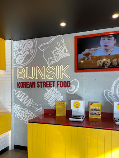 Completed Bunsik Griffith restaurant fit-out featuring a dedicated ordering counter, self-service ramen station and efficient customer service layout.
