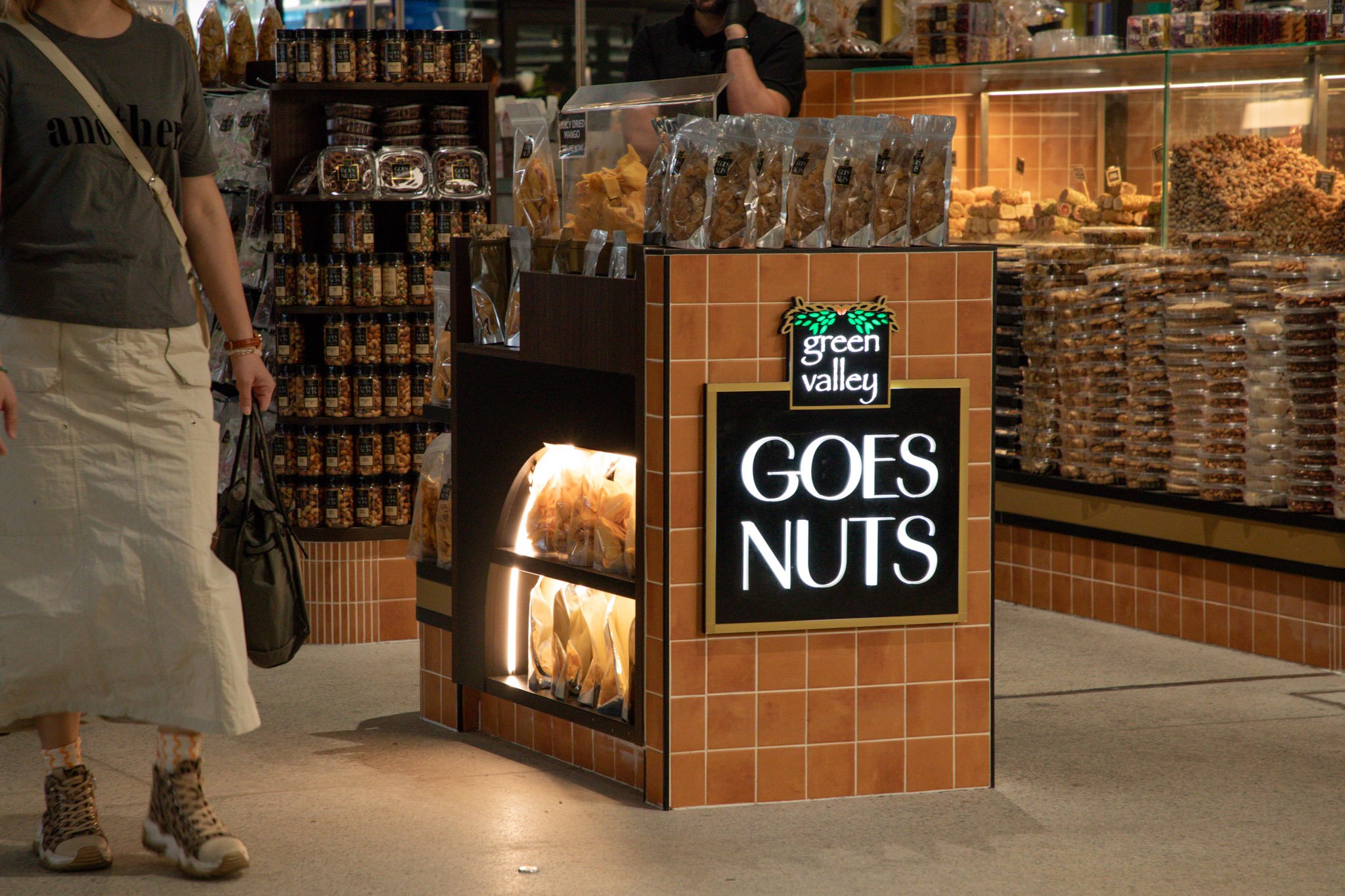 Green Valley Goes Nuts Sydney Fish Market kiosk featuring custom joinery displays, integrated signage and feature lighting completed as part of the retail fit-out