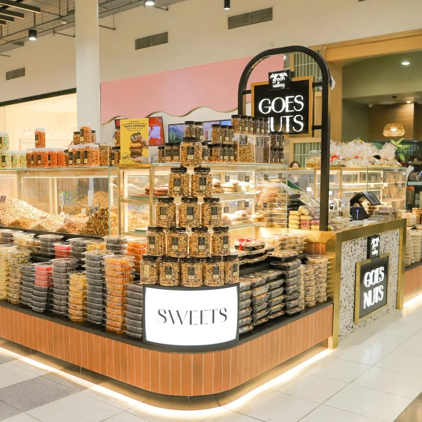 Green Valley Goes Nuts Lidcombe retail fit-out featuring a custom terrazzo counter, integrated signage and a considered specialty food kiosk design.