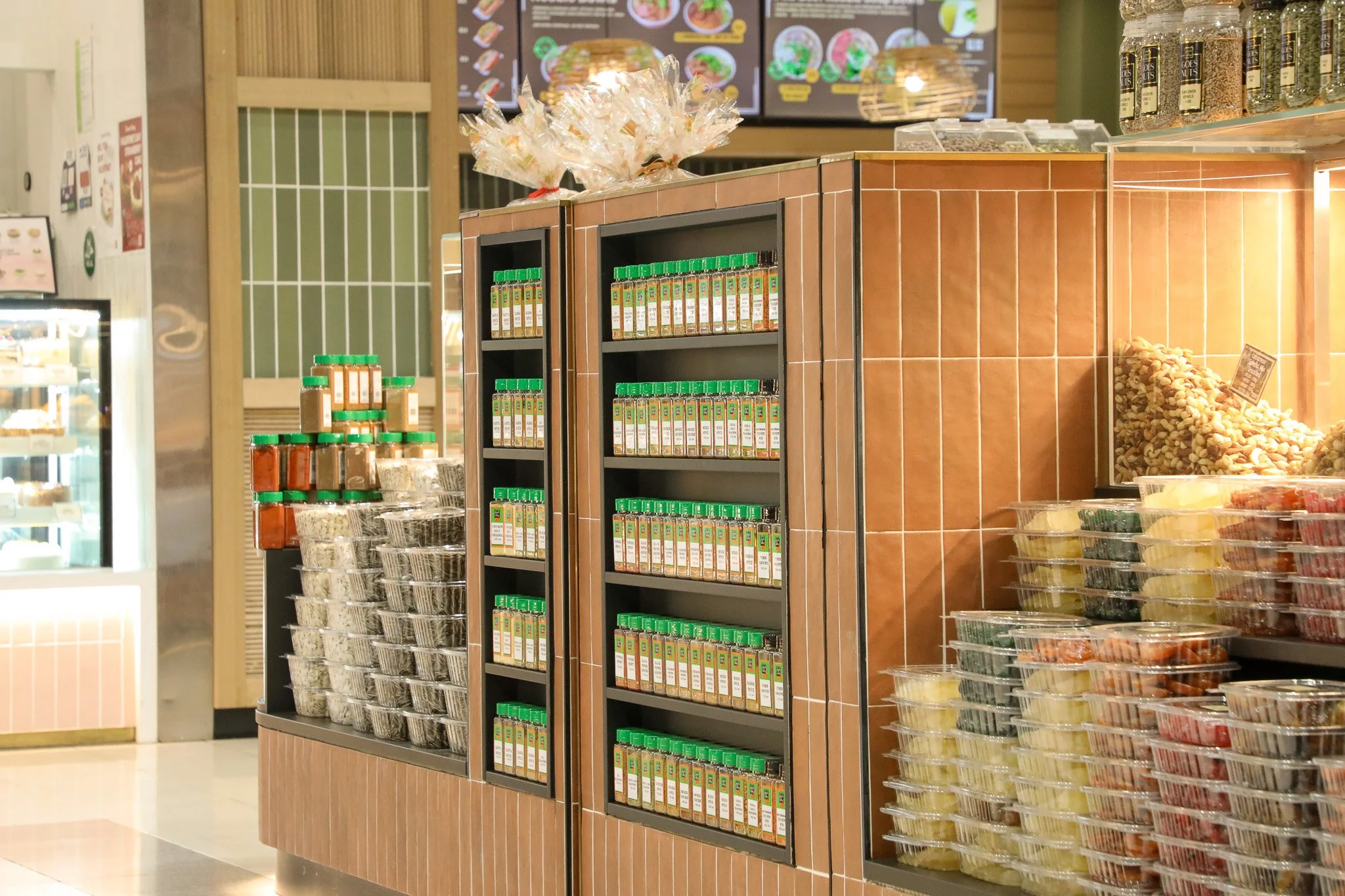 Green Valley Goes Nuts Lidcombe kiosk featuring an integrated spice display within the service door, maximising functionality and retail storage.
