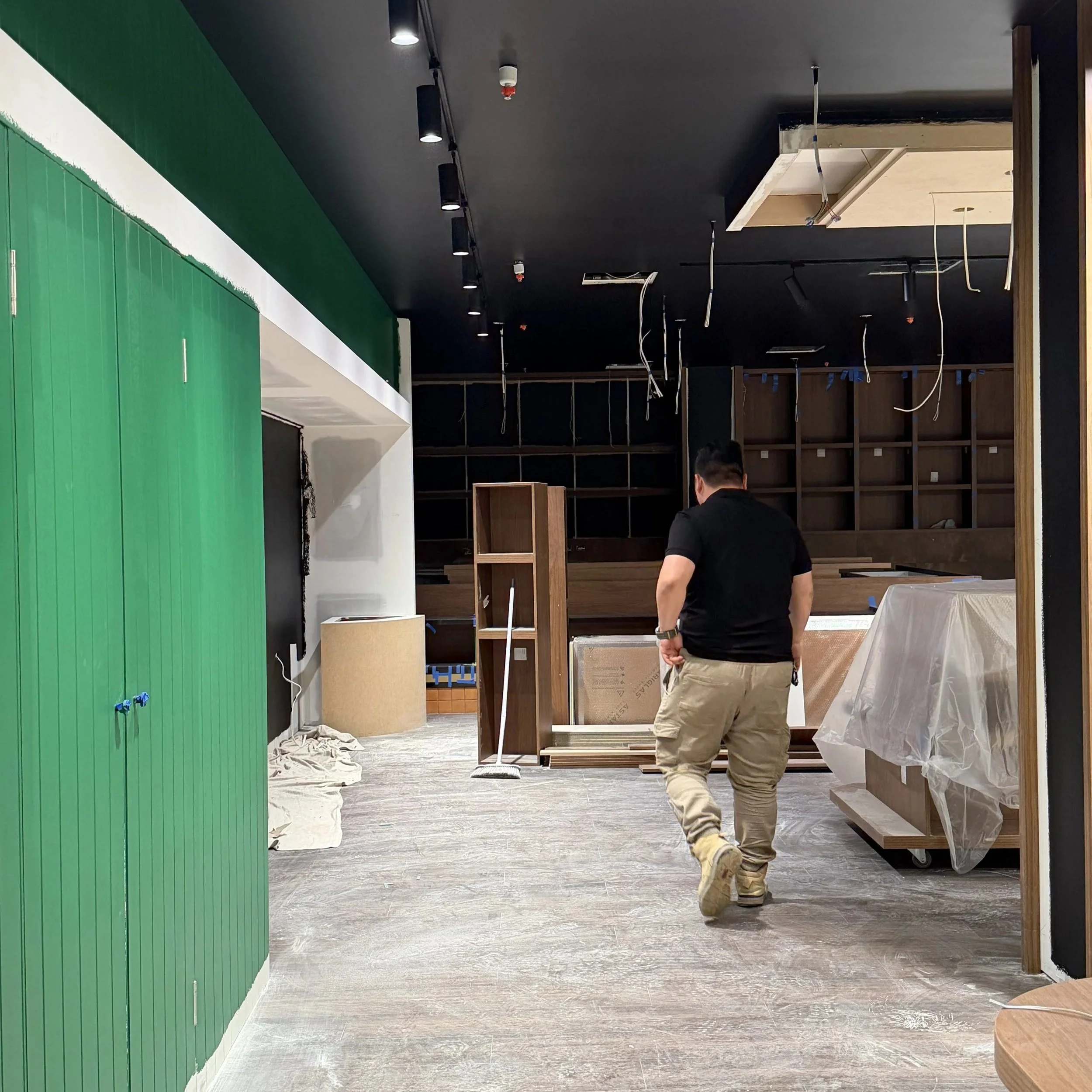 Commercial joinery installation underway within the retail store.