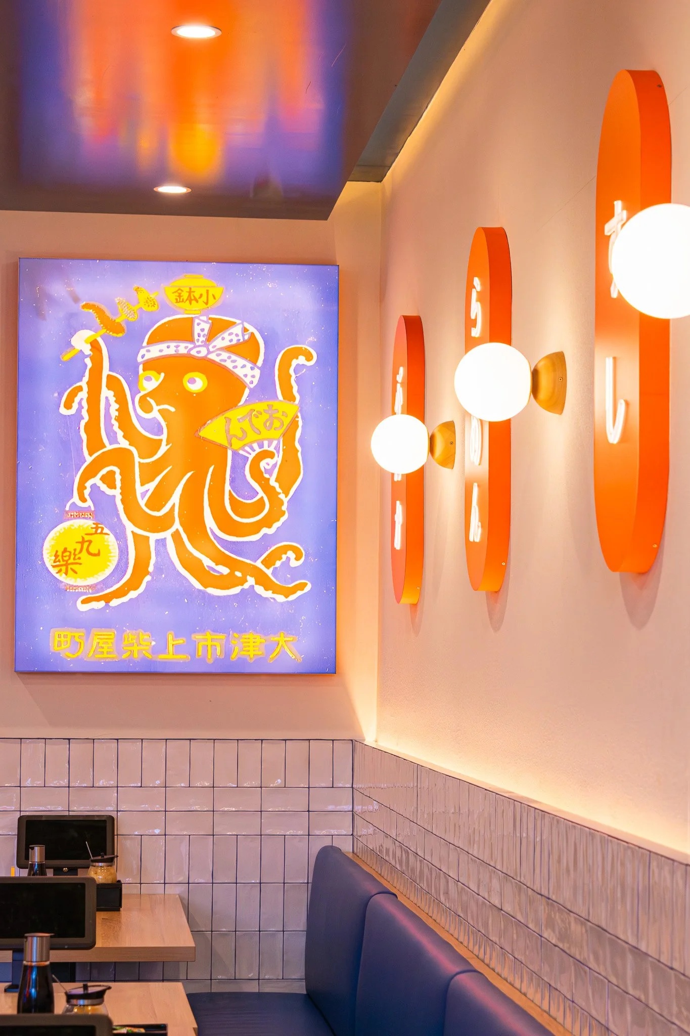 Illuminated Sushi Culture signage welcoming customers to the restaurant.