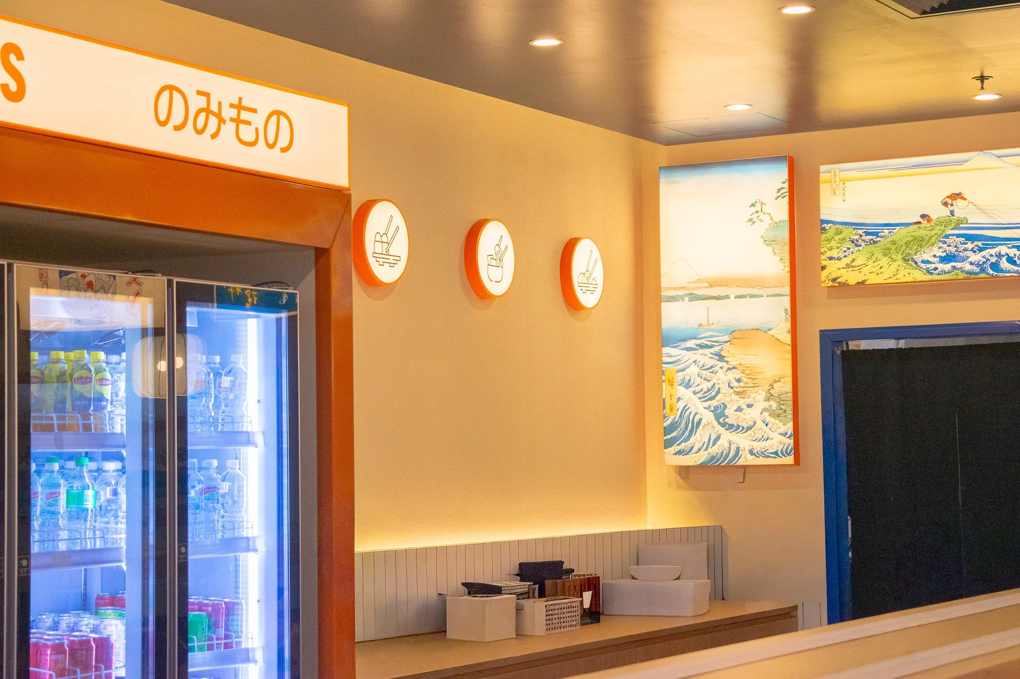 Feature wall with Sushi Culture branding, textured finishes and integrated lighting.