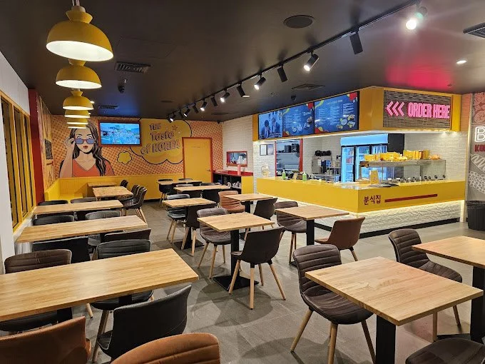 Completed Bunsik Griffith restaurant interior showcasing the dining area, branded graphics and contemporary hospitality fit-out.