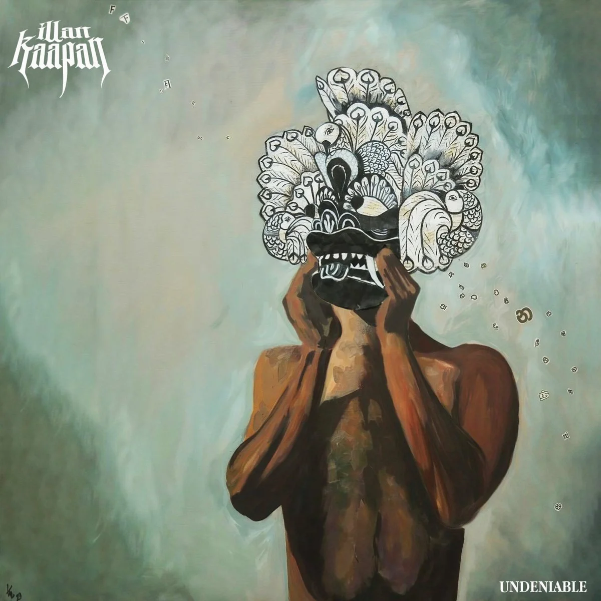 A painting of a person with their back turned, holding a mask resembling a peacock's face in front of their head. The mask features intricate black and white patterns. The background is a gradient of teal and light green, with the words 'Illar Kaapan' in stylized font in the top left corner and the word 'UNDERNIBLE' in white in the bottom right.