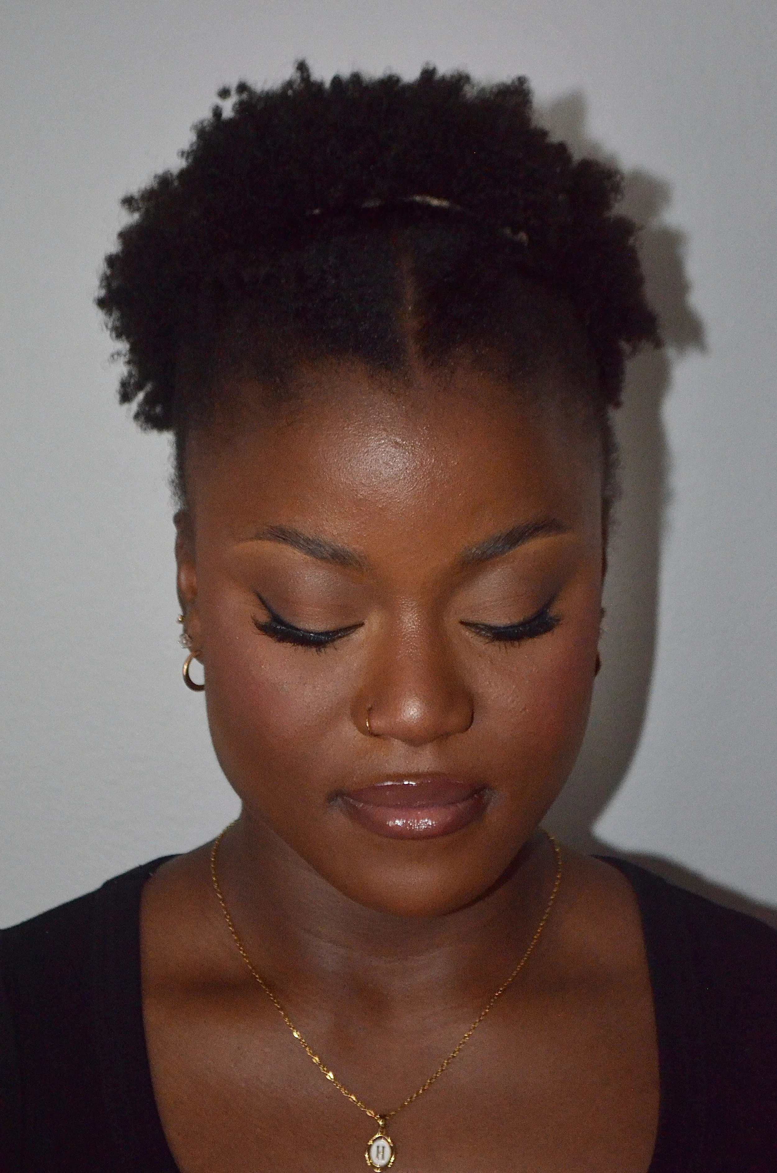 Boise makeup artistry soft glam bridal look with neutral, pinky toned eyeshadow, defined brows, glowing skin and glossy nude lips.