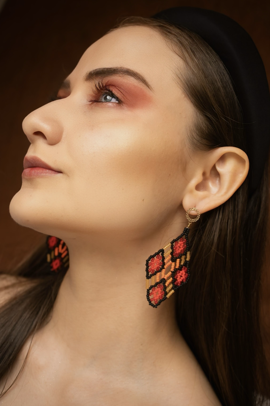 handmade-red-black-beaded-earring-profile-portrait.png