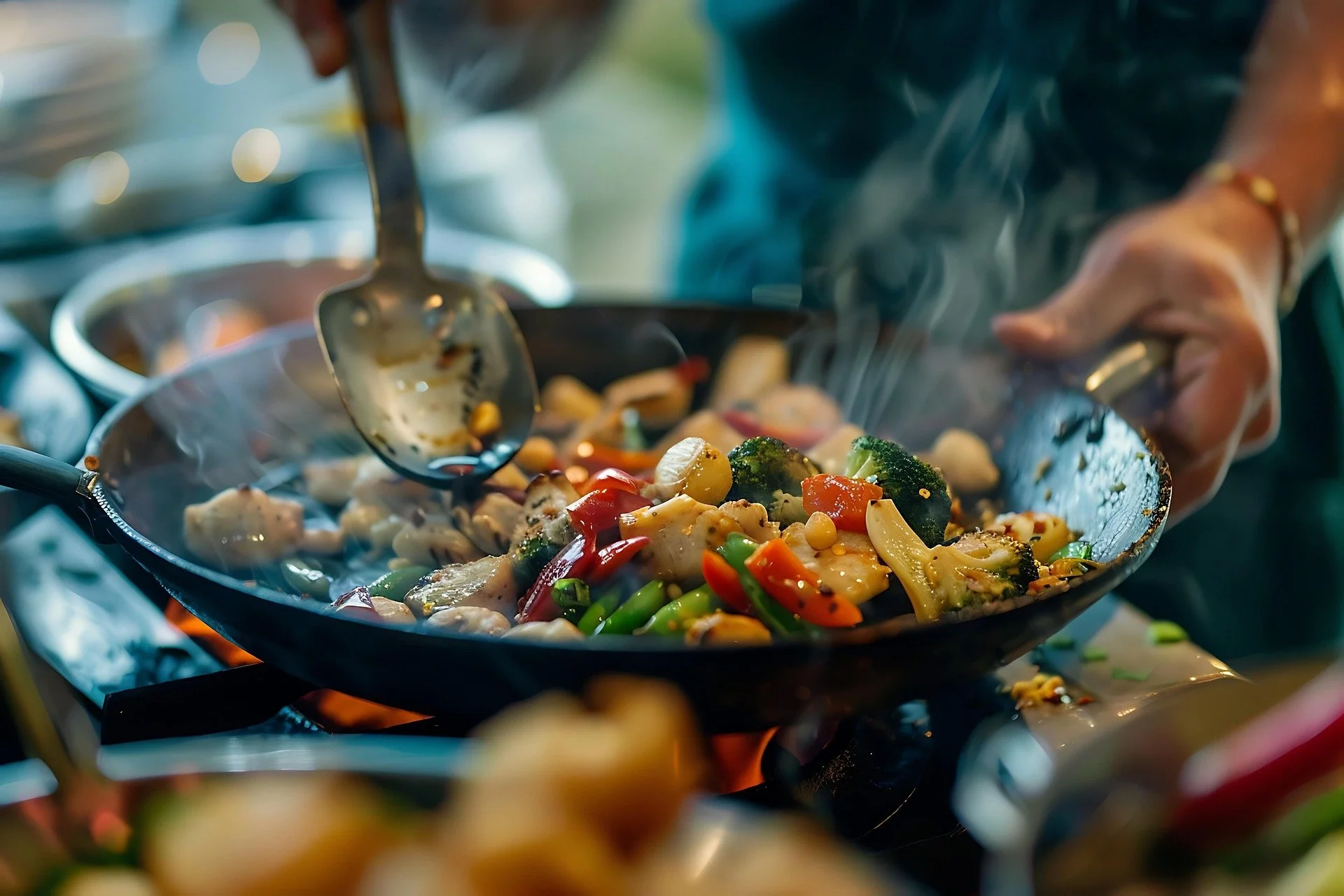 A person cooking vegetables in a skillet over an open flame, with steam rising from the food.