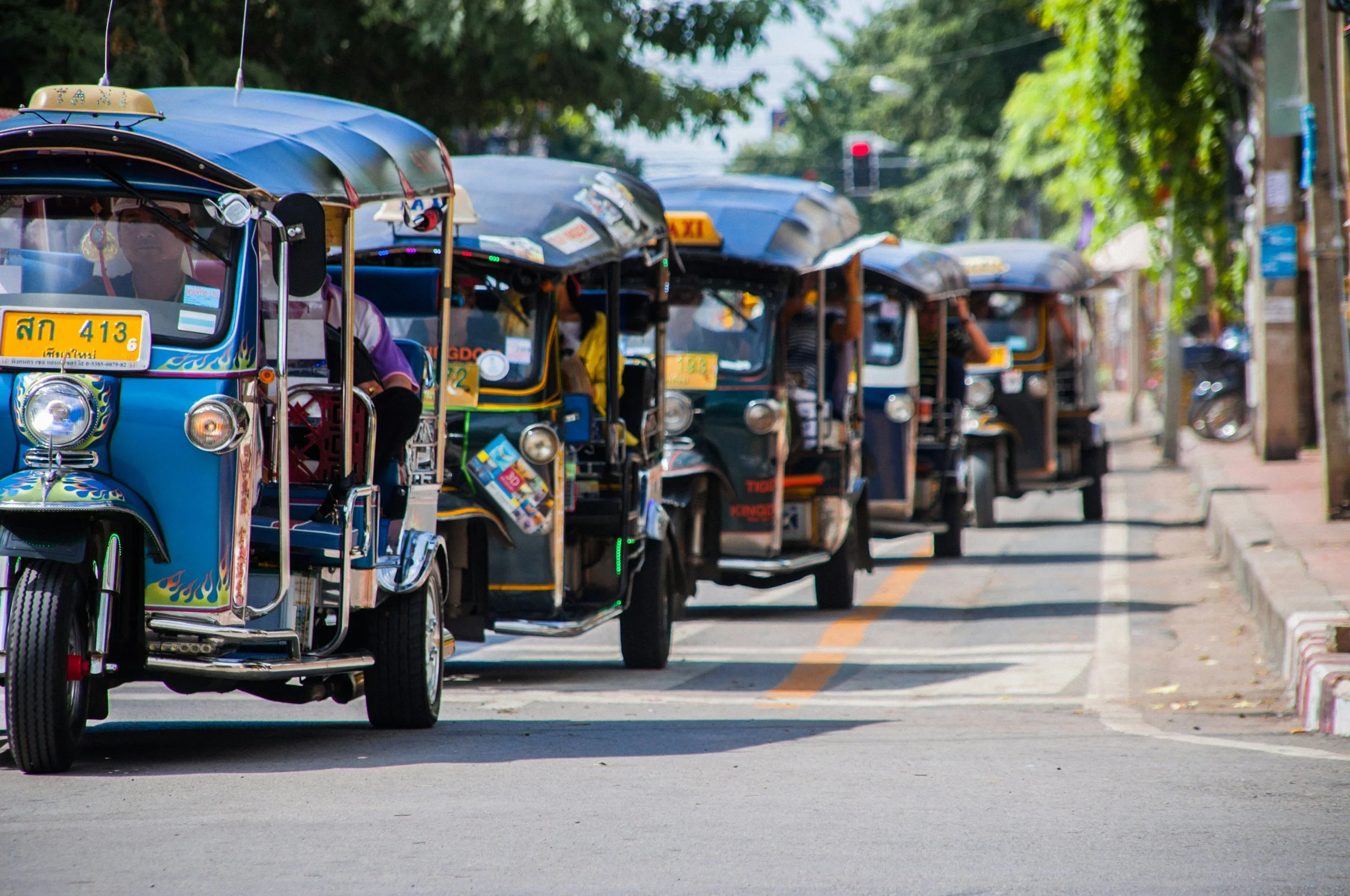 colourful tuk-tuks lined up along the road, offering a relaxed and practical way to move through town