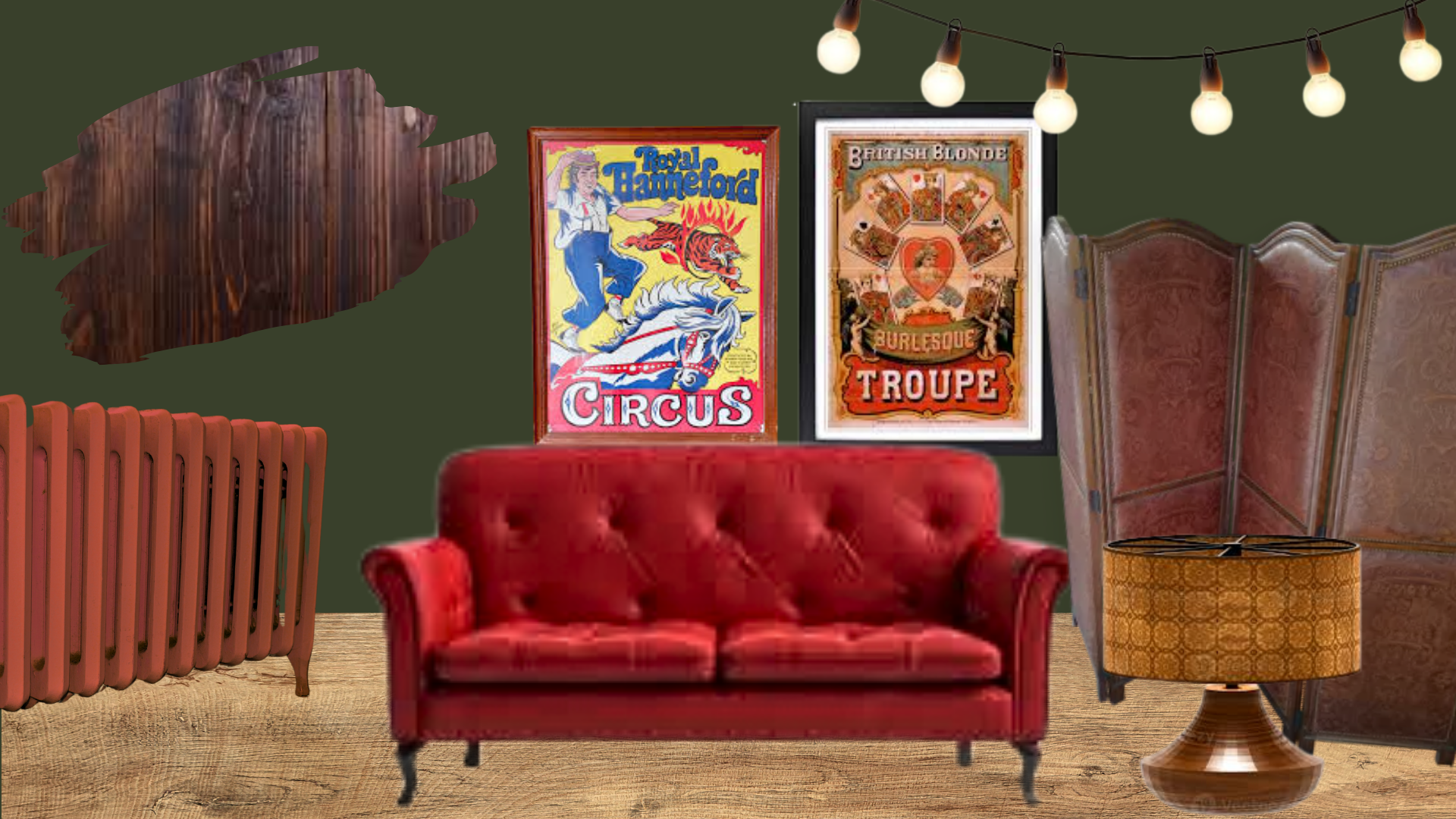 A cozy living room corner with vintage decor, including framed circus and burlesque posters on a dark green wall, a red velvet tufted sofa, a wooden and metal side table with a gold patterned lamp, a tiered wooden room divider, and a string of white 