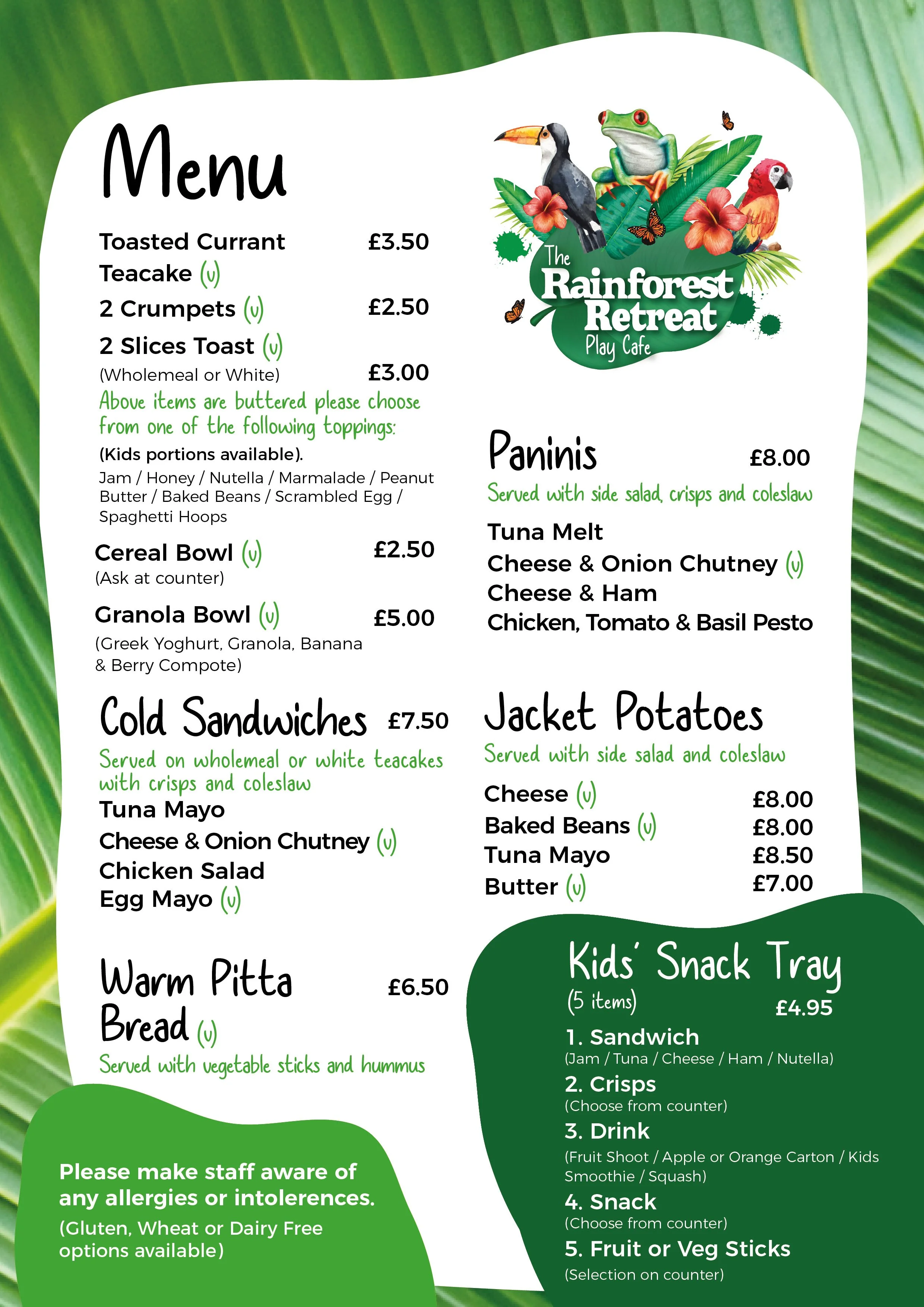 Menu from The Rainforest Retreat Play Cafe with options including toasted currant, teacake, crumpets, slices of toast, cereal bowl, granola bowl, cold sandwiches, jacket potatoes, warm pitta bread, and kids' snack tray, featuring illustrations of rainforest animals and plants.