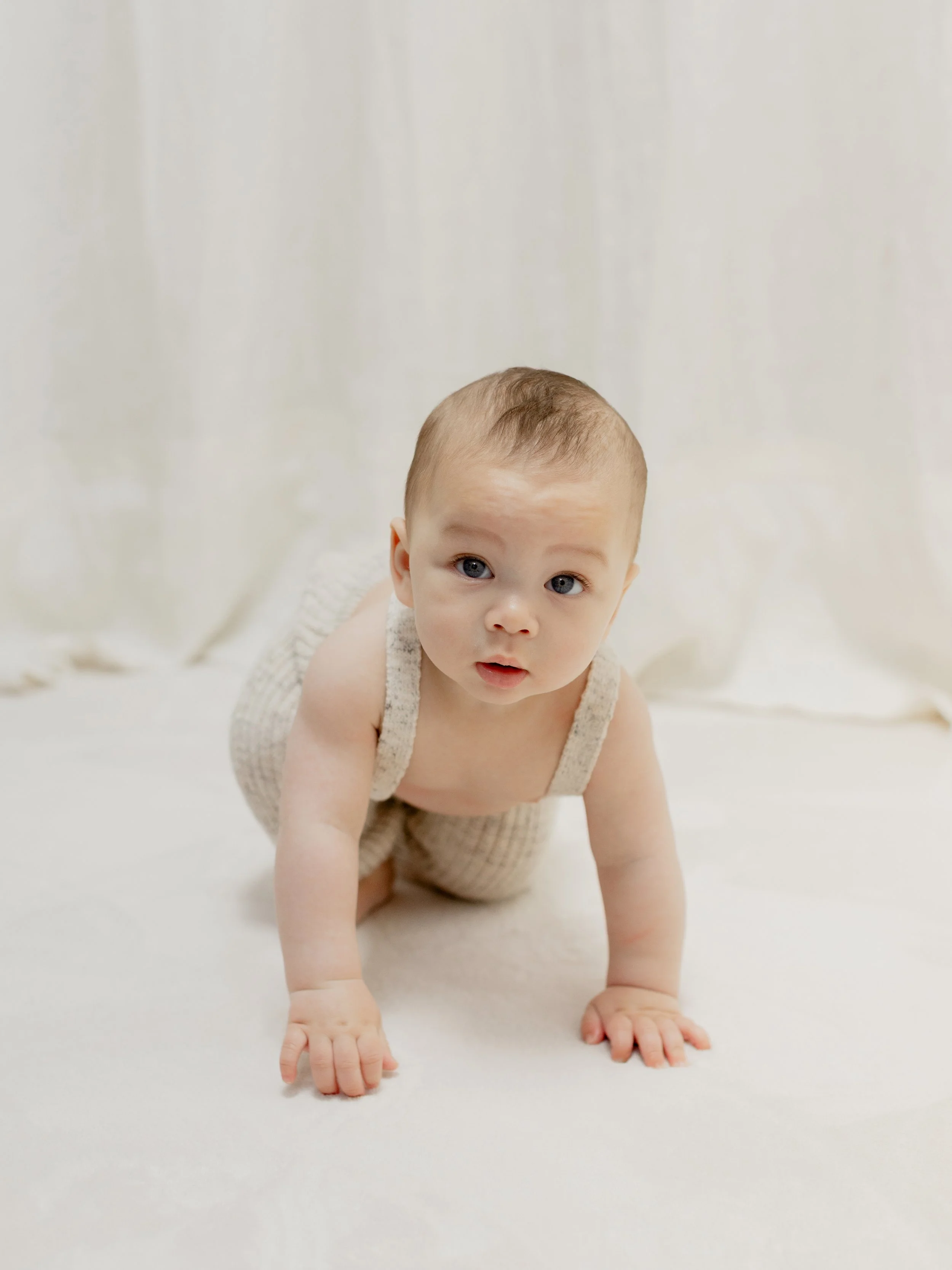 Baby model portfolio portrait photographed in a studio in Essex
