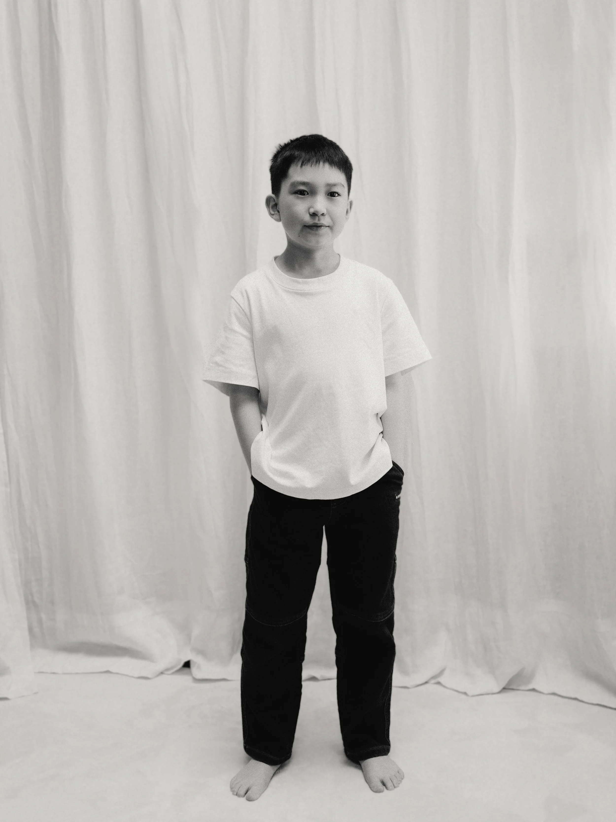 Full length child model portfolio photograph in black and white