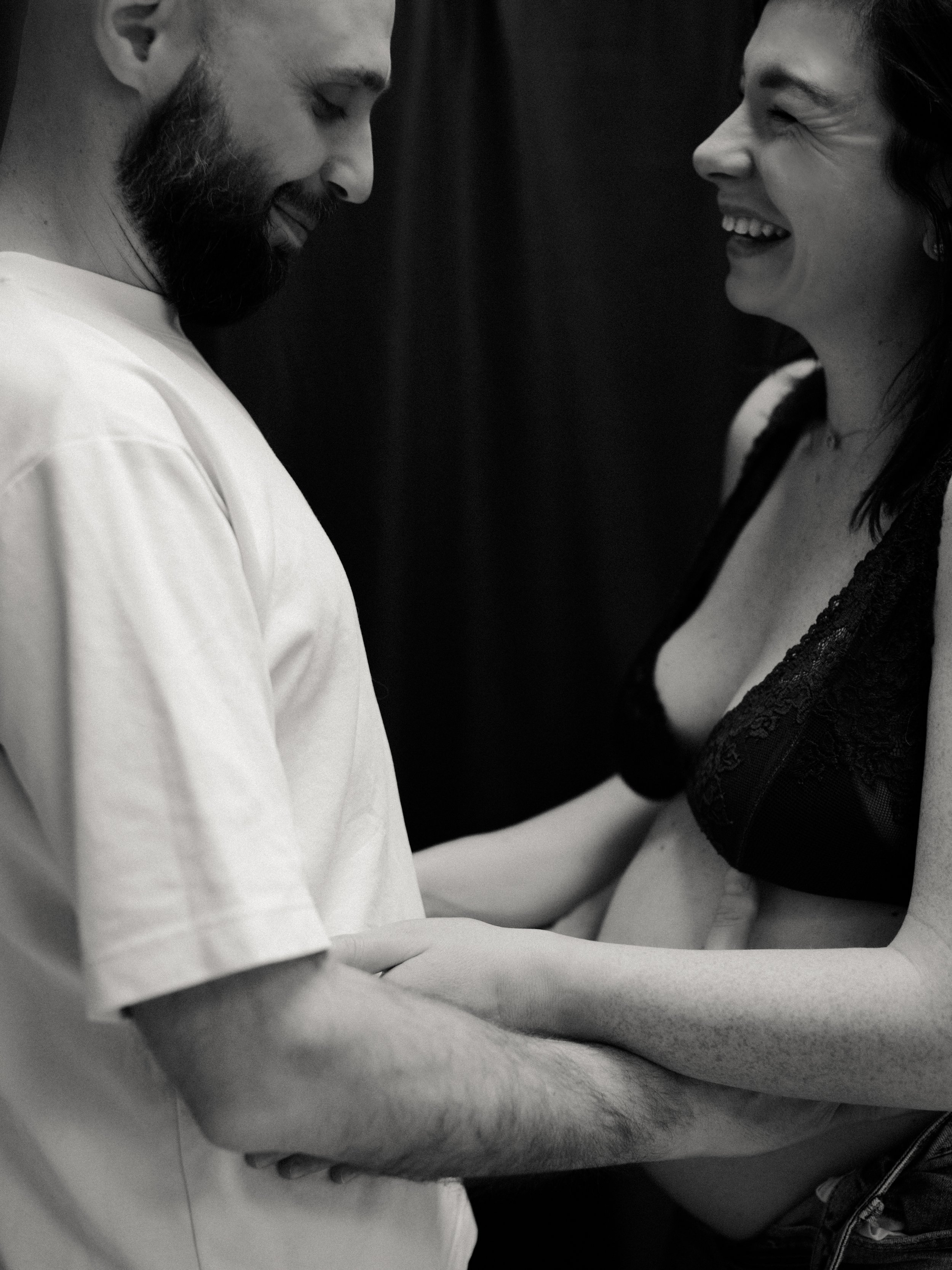 Black and white maternity portrait of an expectant couple together during their studio session