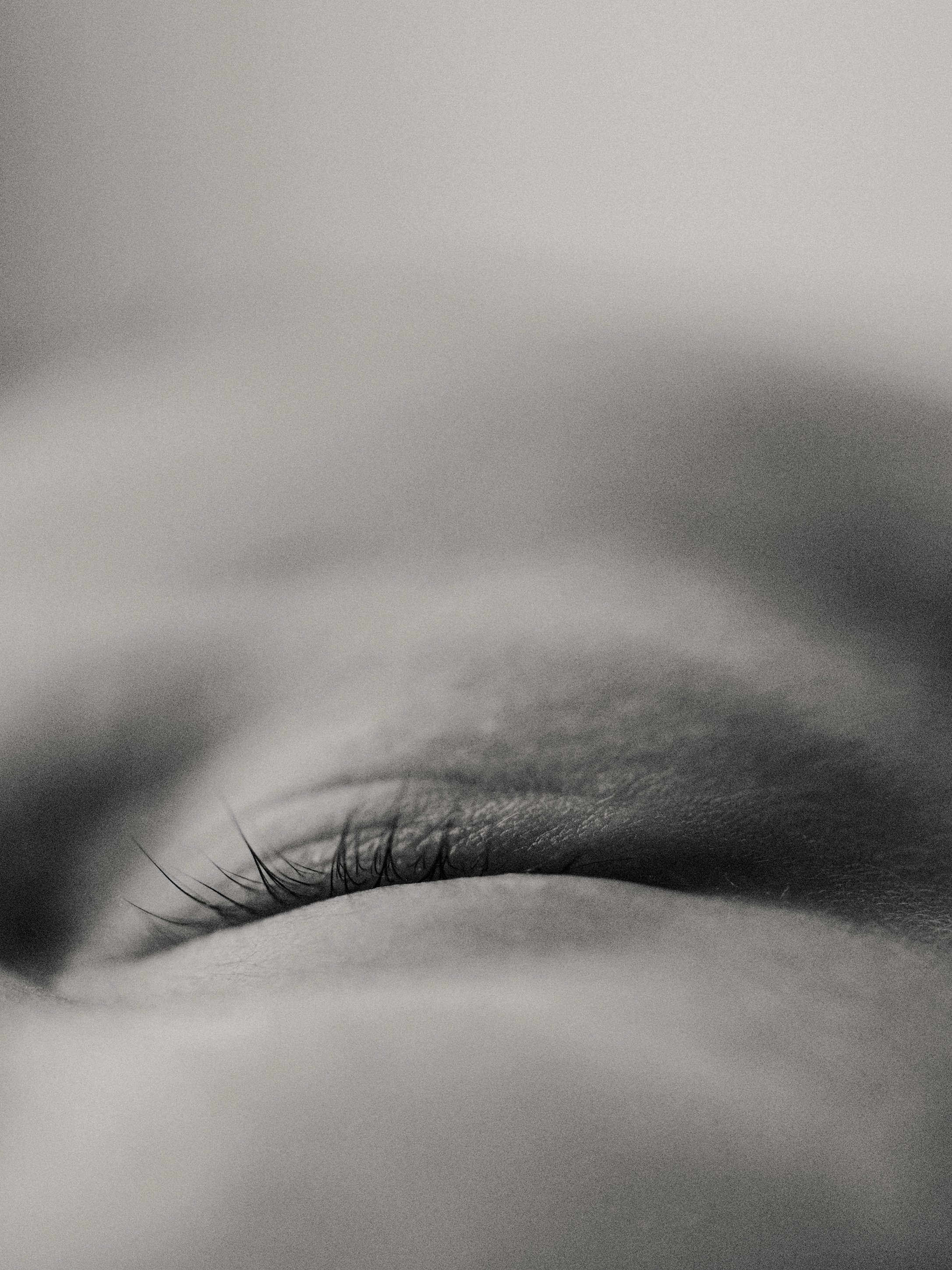 Black and white close-up of a newborn baby's eyelashes