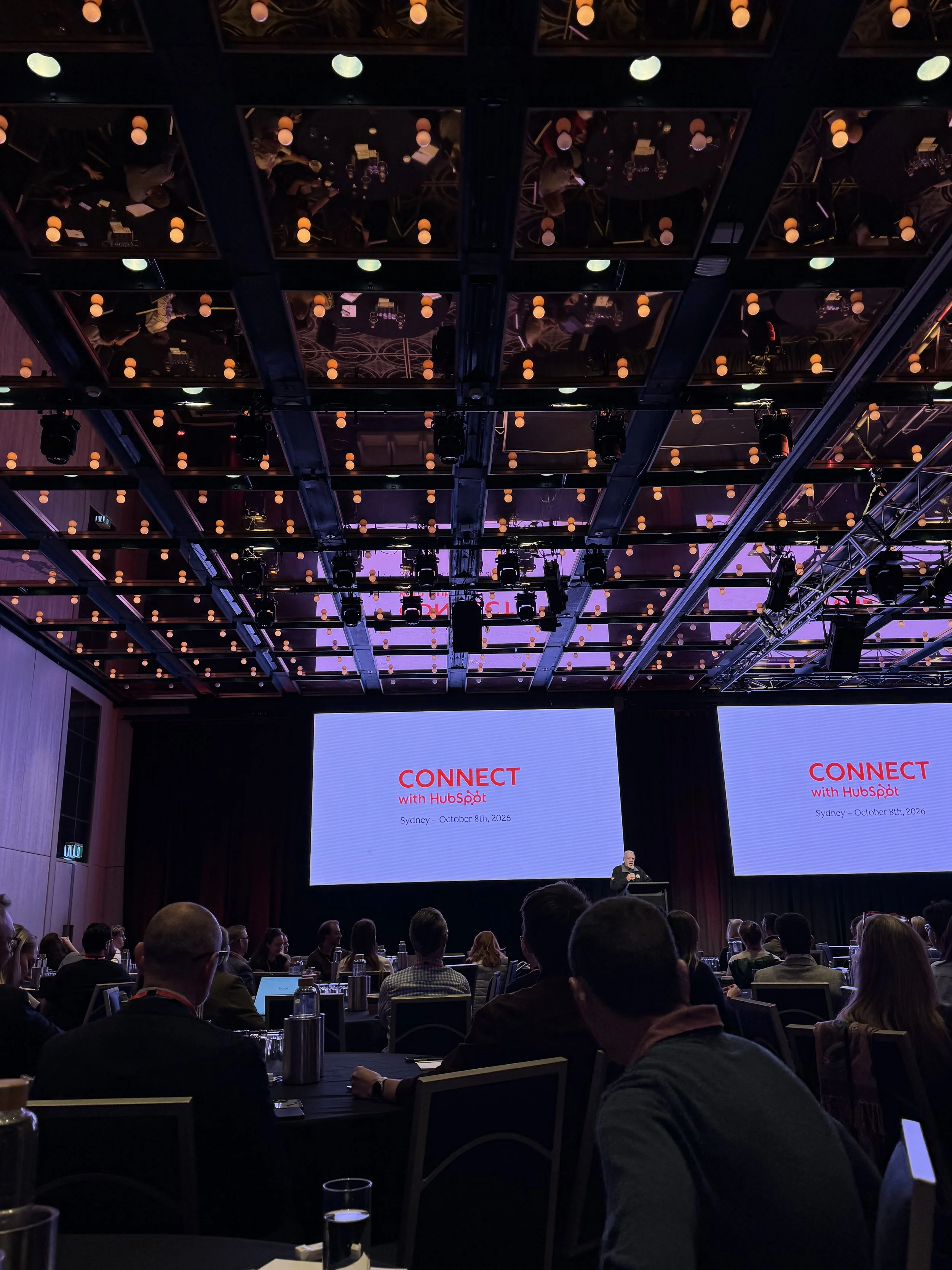 HubSpot Connect in Sydney 2026. Conference room with presentation on the screen.