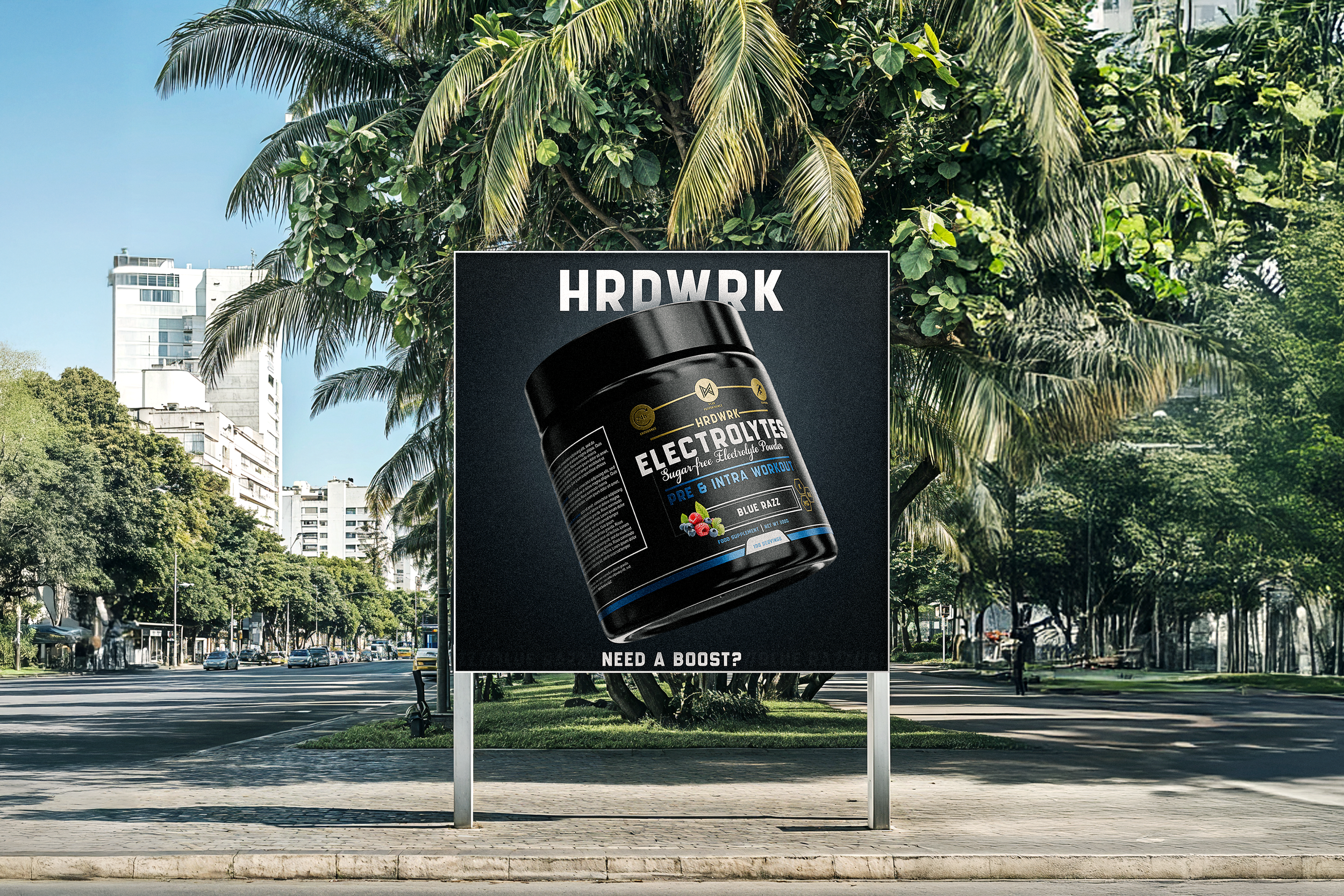 Billboard advertisement for HRDWRK Electrolytes powder with black container and blue accents, placed on a city street with tall buildings, green trees, and palm trees in the background.