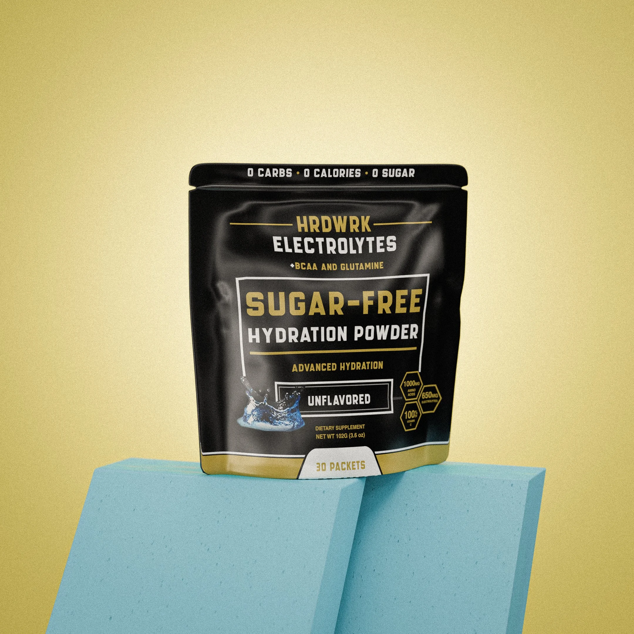 Black and gold bag of sugar-free hydration powder with electrolyte formula, placed on a blue rectangular block against a yellow background.