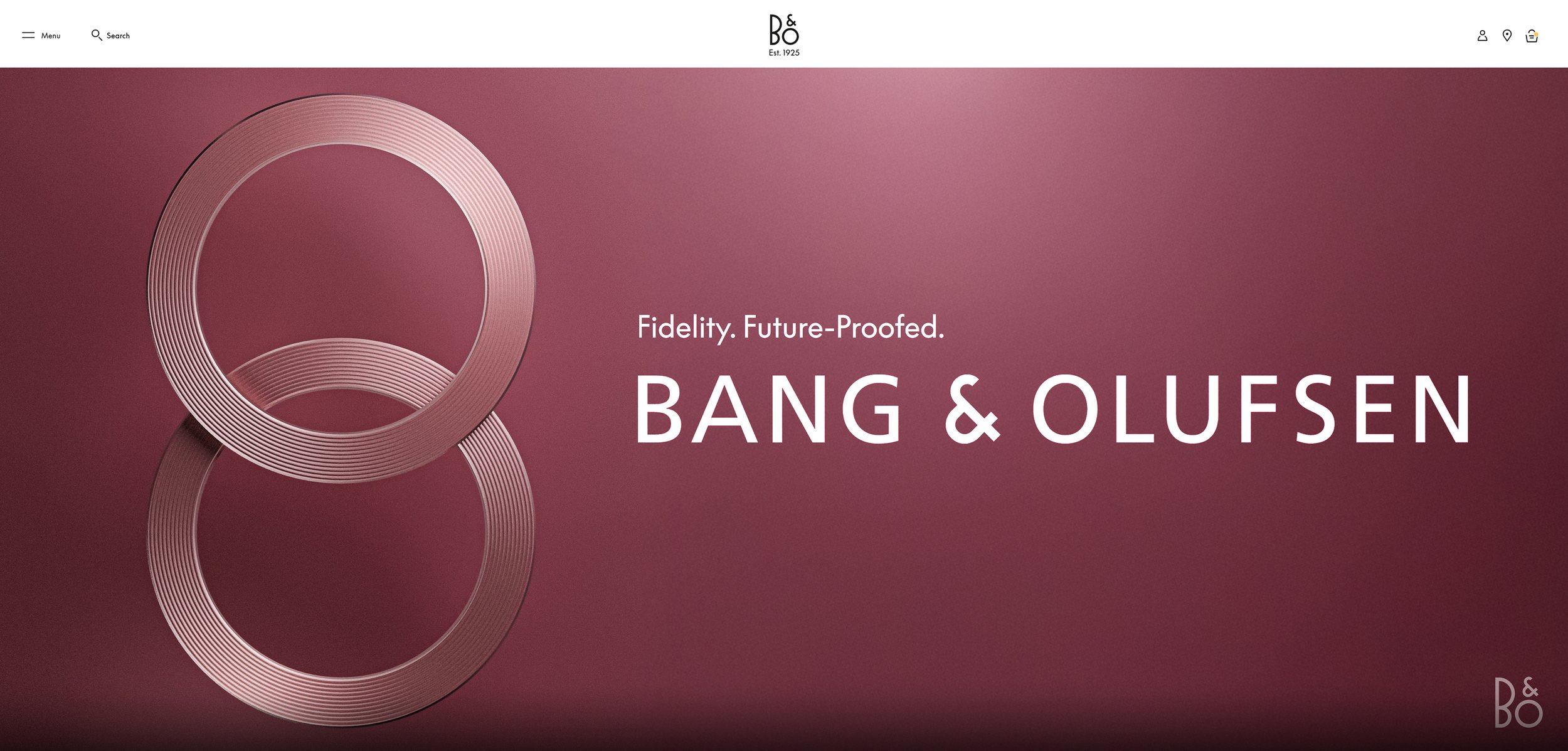 A sleek product webpage featuring two metallic rings and the text 'Fidelity. Future-Proofed. BANG & OLUFSEN' on a pink background, with the Bang & Olufsen logo in the upper right corner.