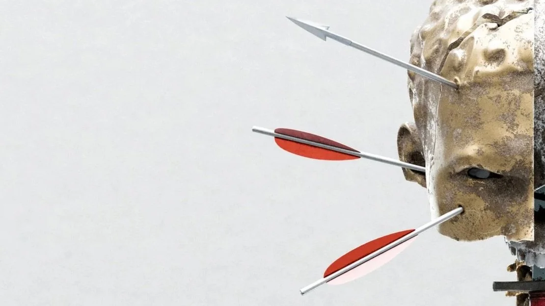 A weathered mask with three arrows piercing through it, positioned against a plain, light background.