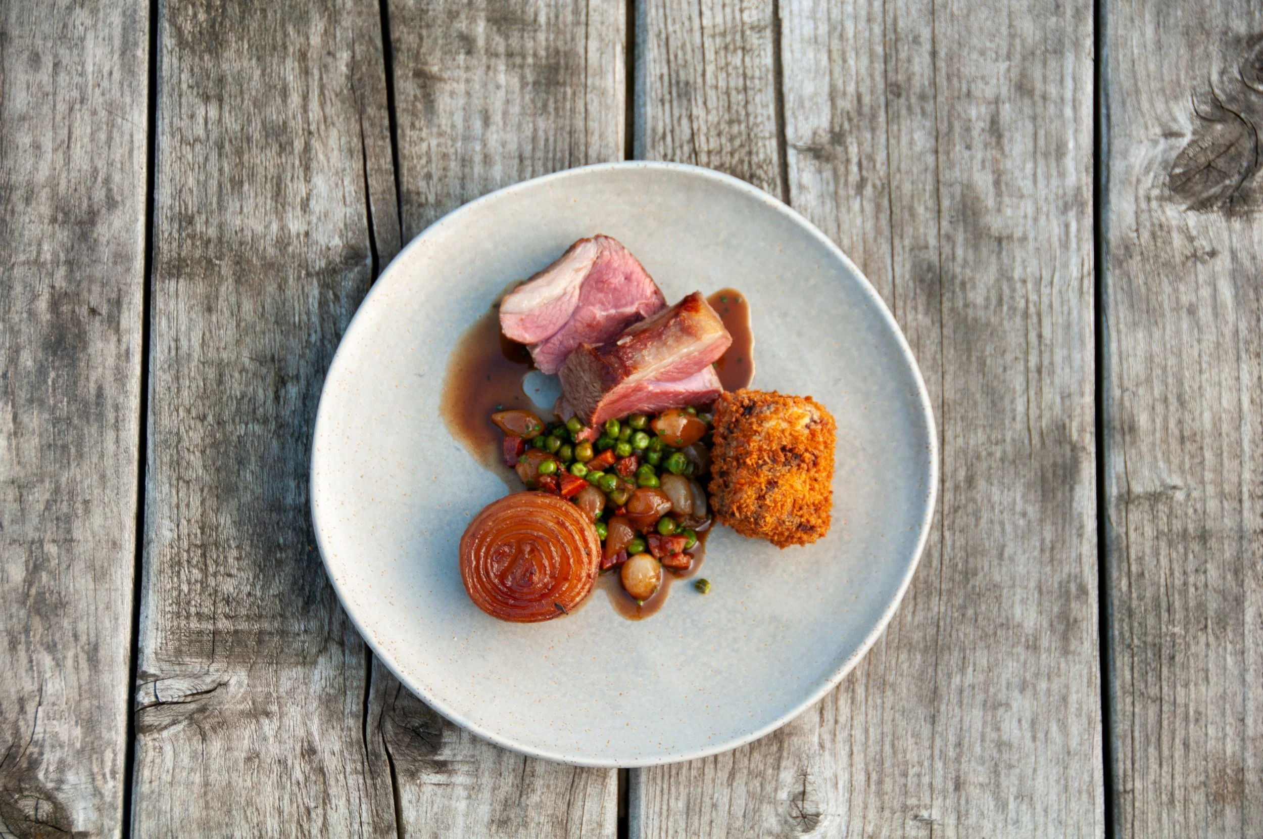 Lamb rump, braised roscoff, lamb croquette, peas & pancetta