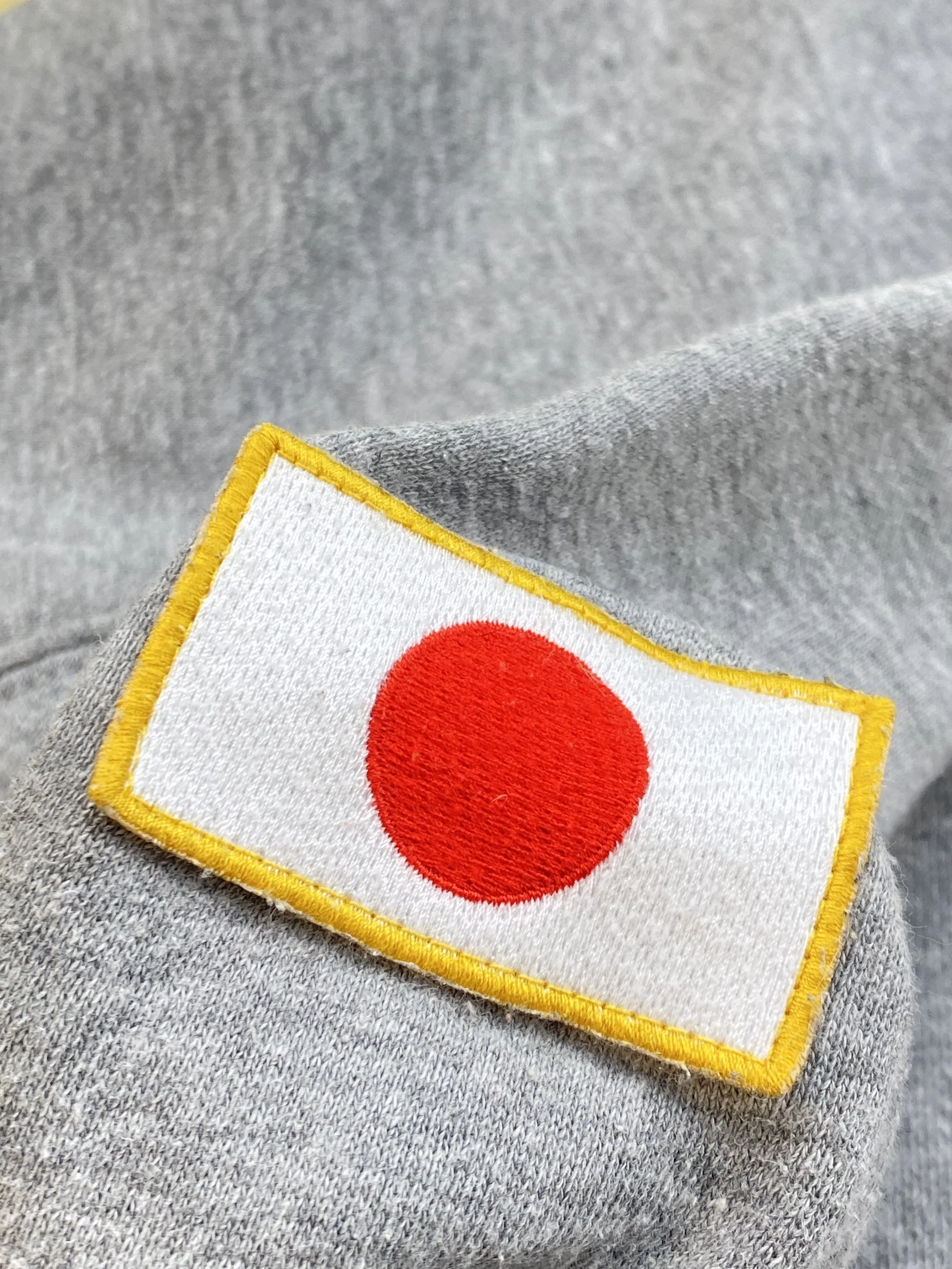 detail of Japanese flag on vintage stüssy Tokyo jumper