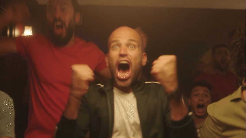 group of people cheering