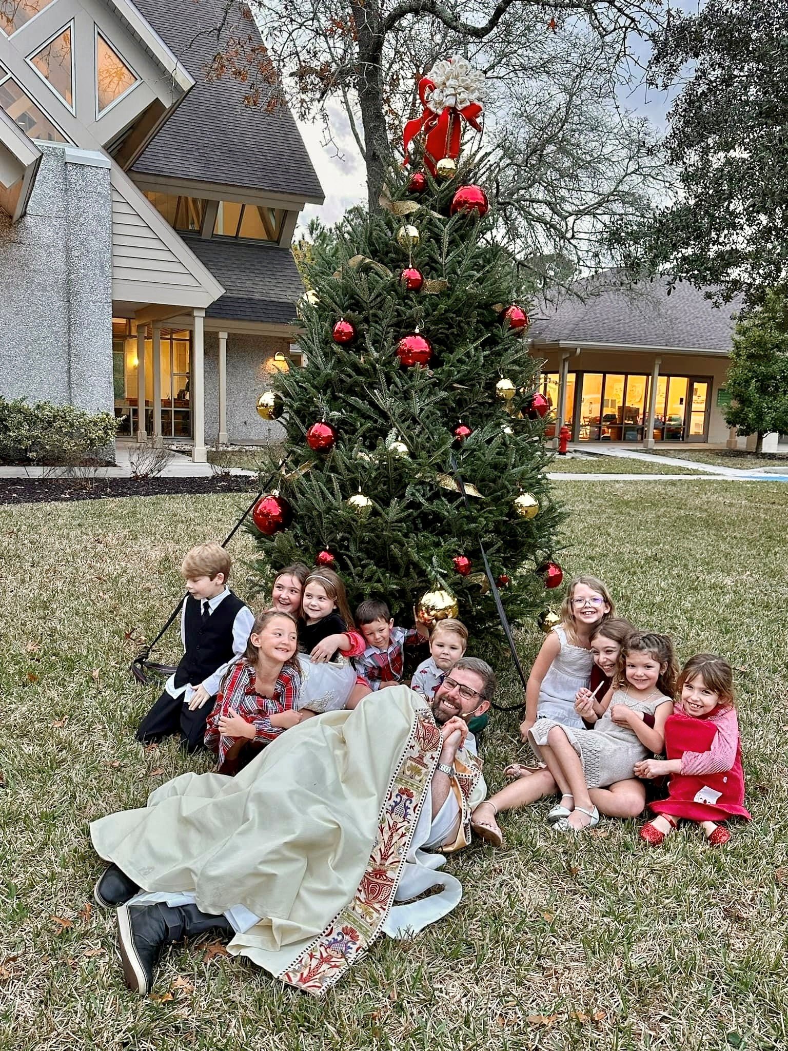 St. Francis PVB Justin with kids at christmas.jpg