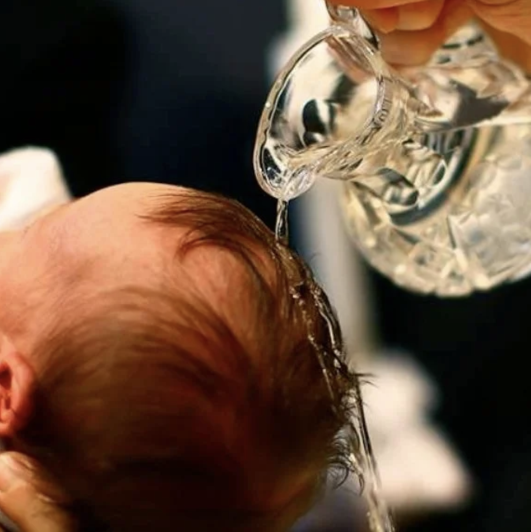 Baptismal pouring of water on the head of a baby