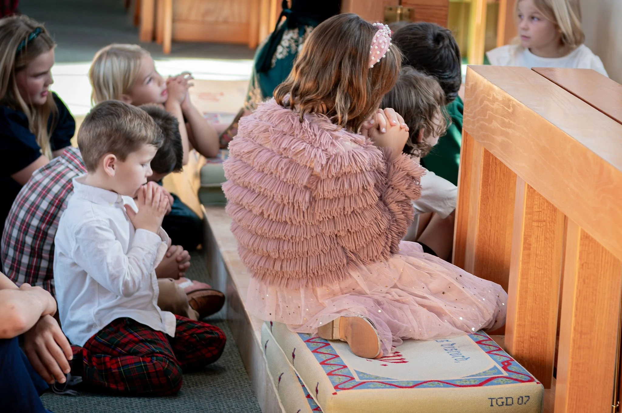 woman serving child communion