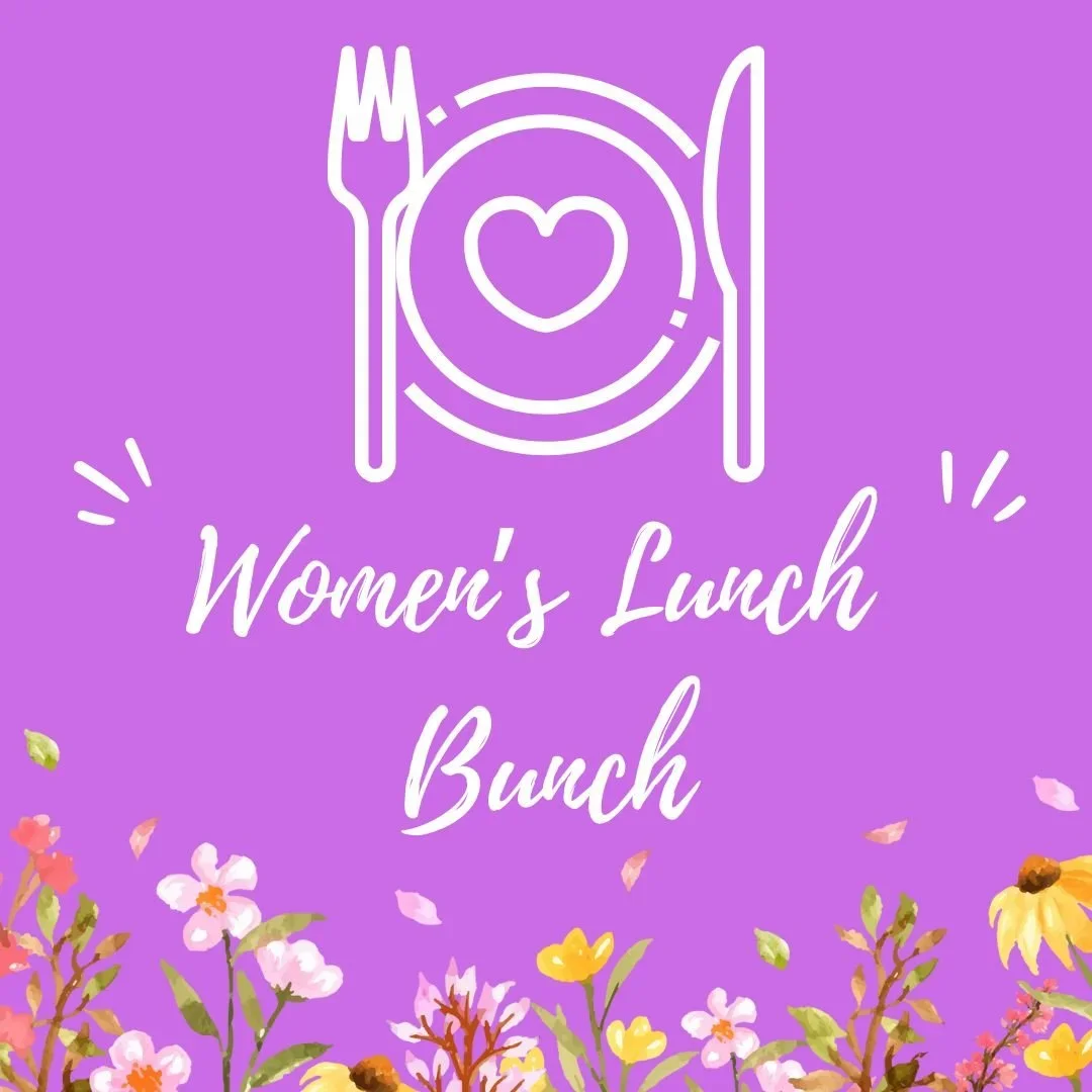 Purple background with white line art of a plate, fork, and knife, with a heart in the center of the plate. Text reads "Women's Lunch Bunch". There are colorful flowers and petals at the bottom.