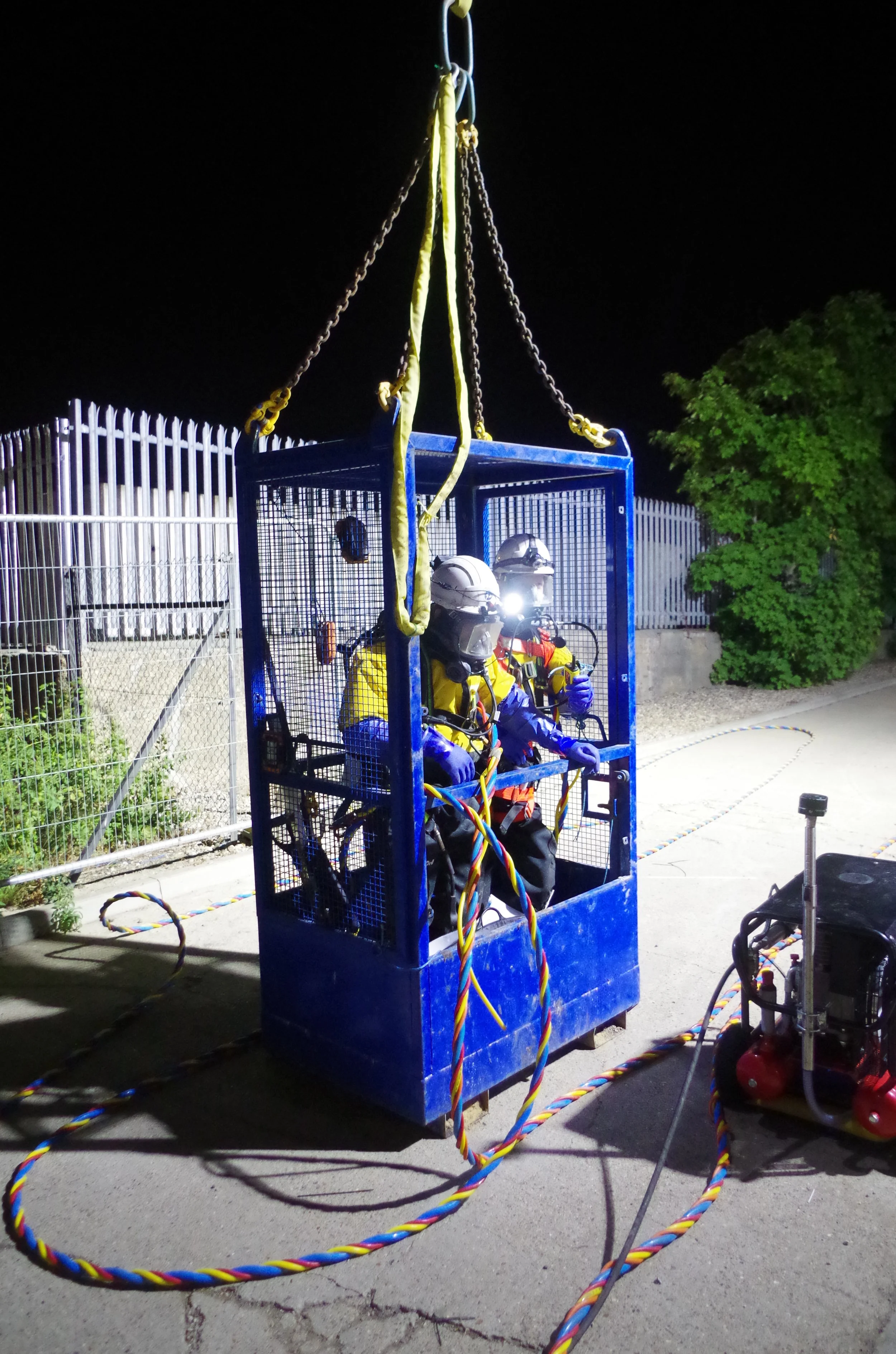 MMP confined space team using surface-supplied beathing apparatus including two way radio to install a secondary isolation plate  