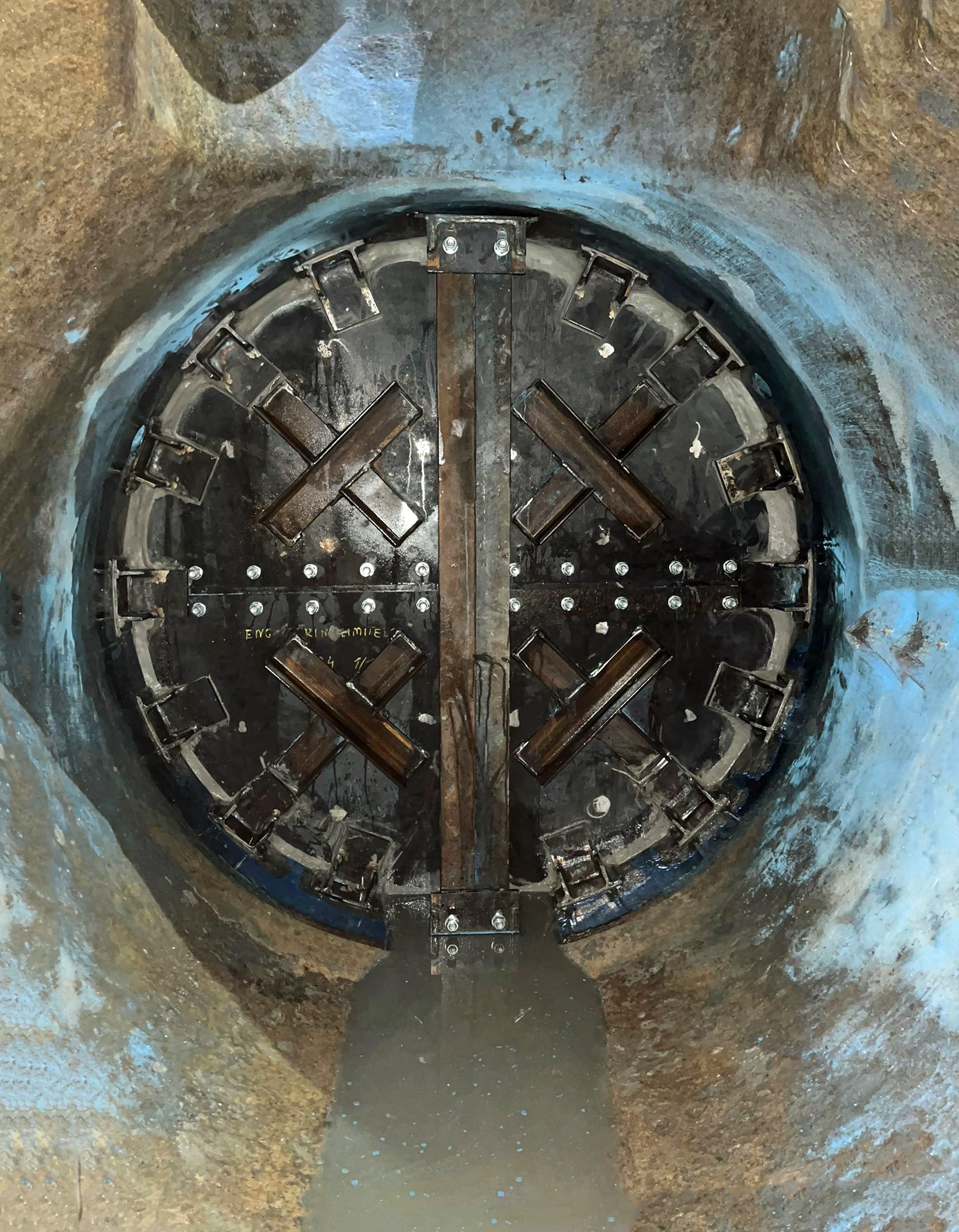 Underground tunnel secondary isolation plate installed by confined space operatives  