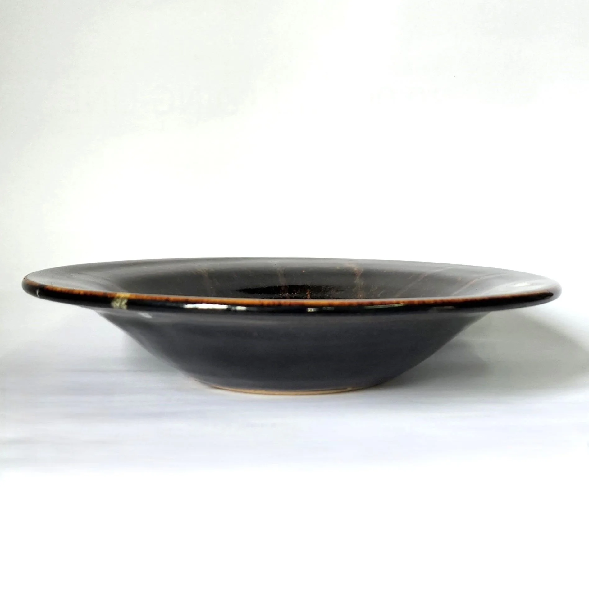 Shallow tenmoku bowl with chun side view.jpg