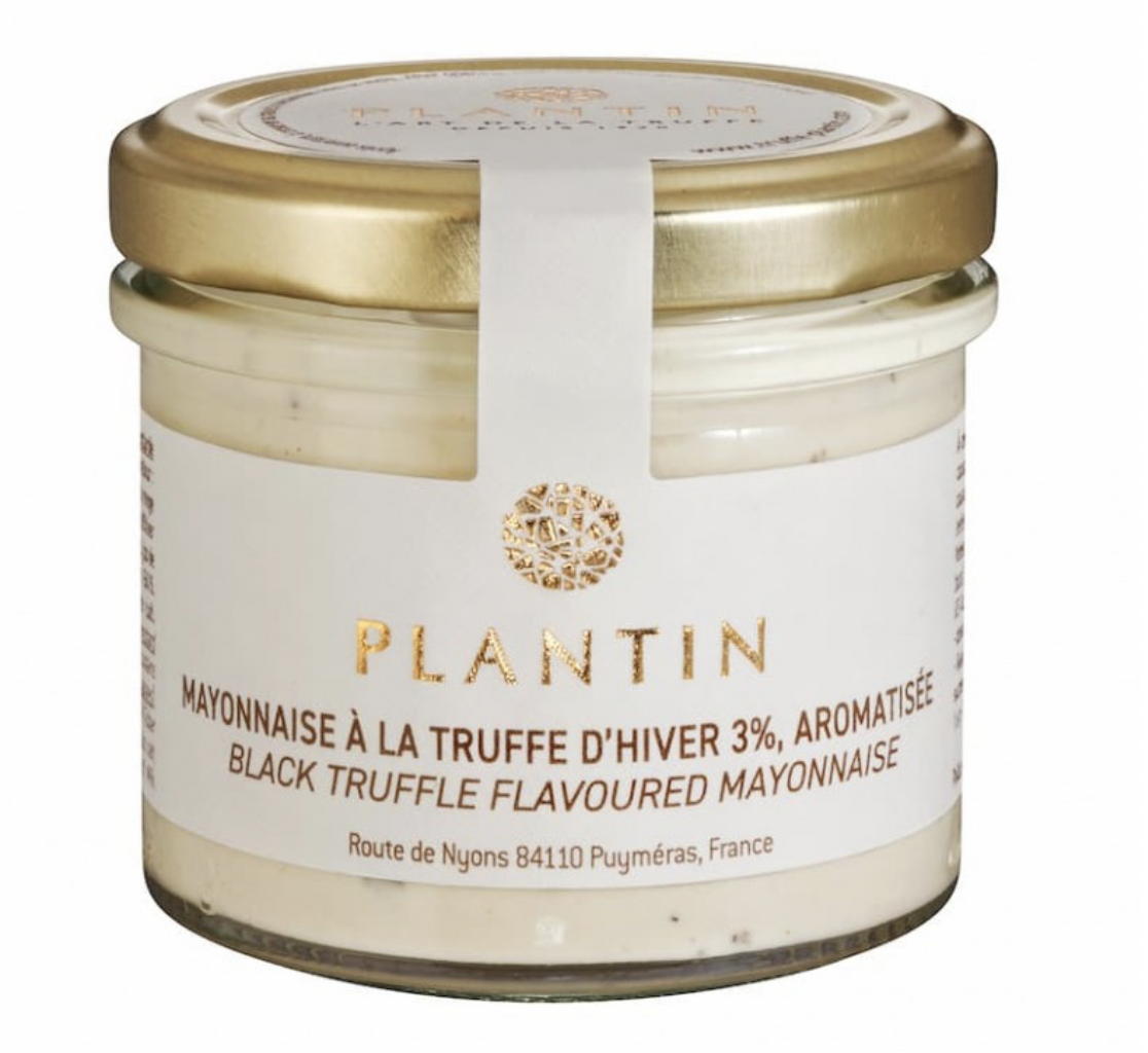 A jar of Plantin brand black truffle flavored mayonnaise with a white label and gold lid.