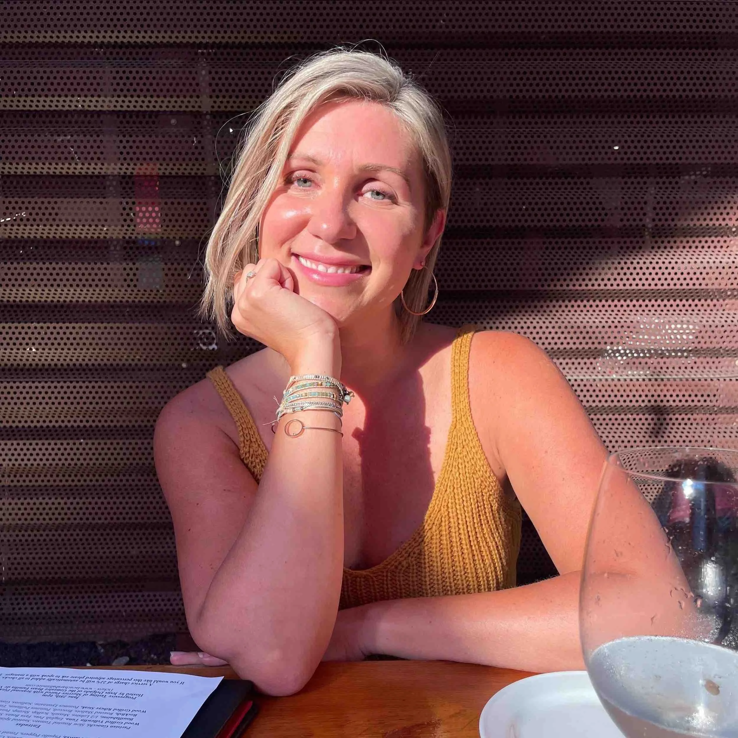 Image of Elizabeth Bauers wearing a yellow shirt, smiling
