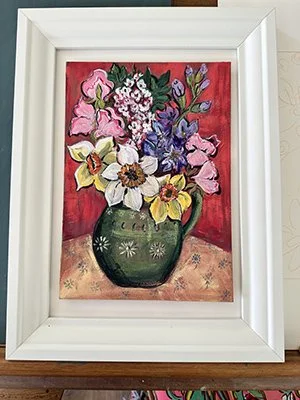 Painting of a bouquet of flowers in a green vase with a red background