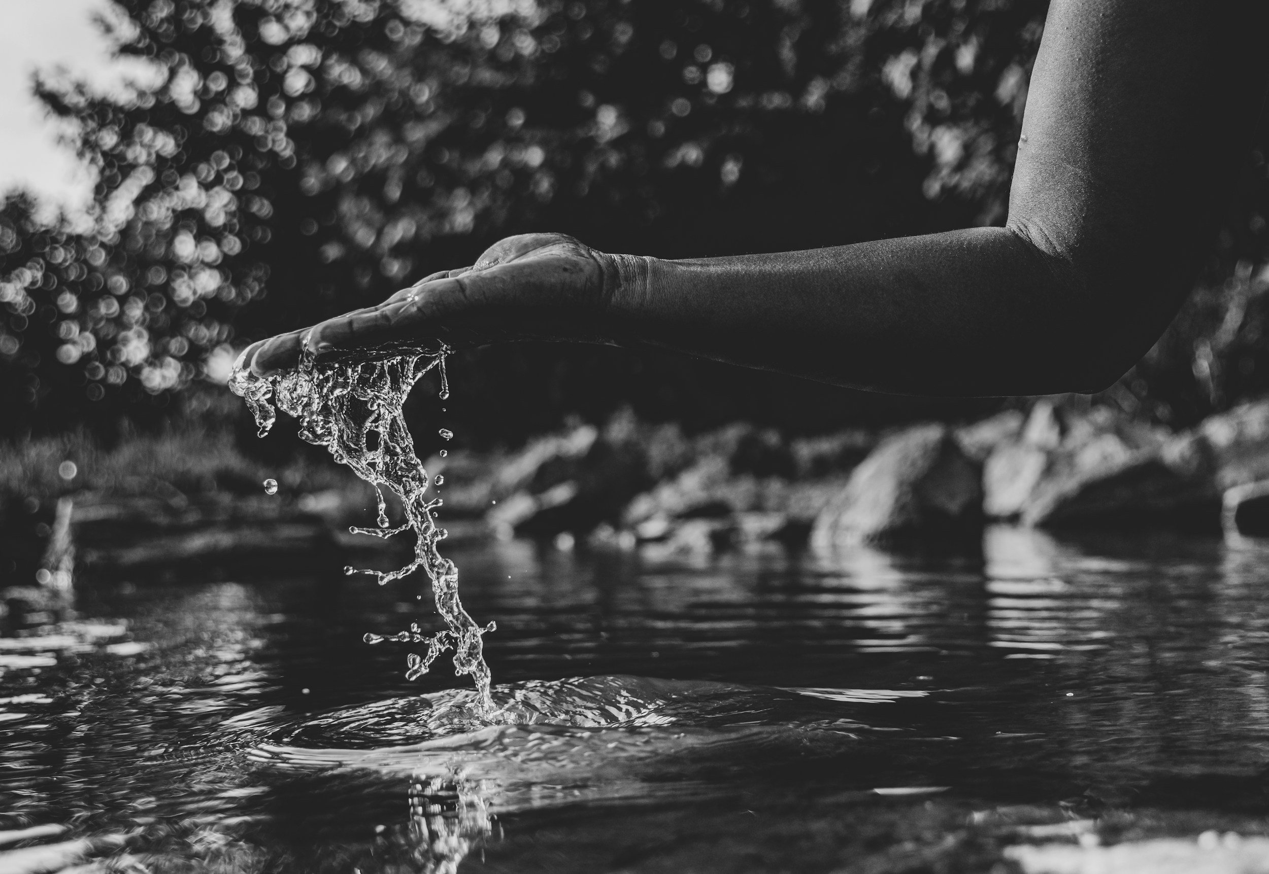 A woman drinking from the well
