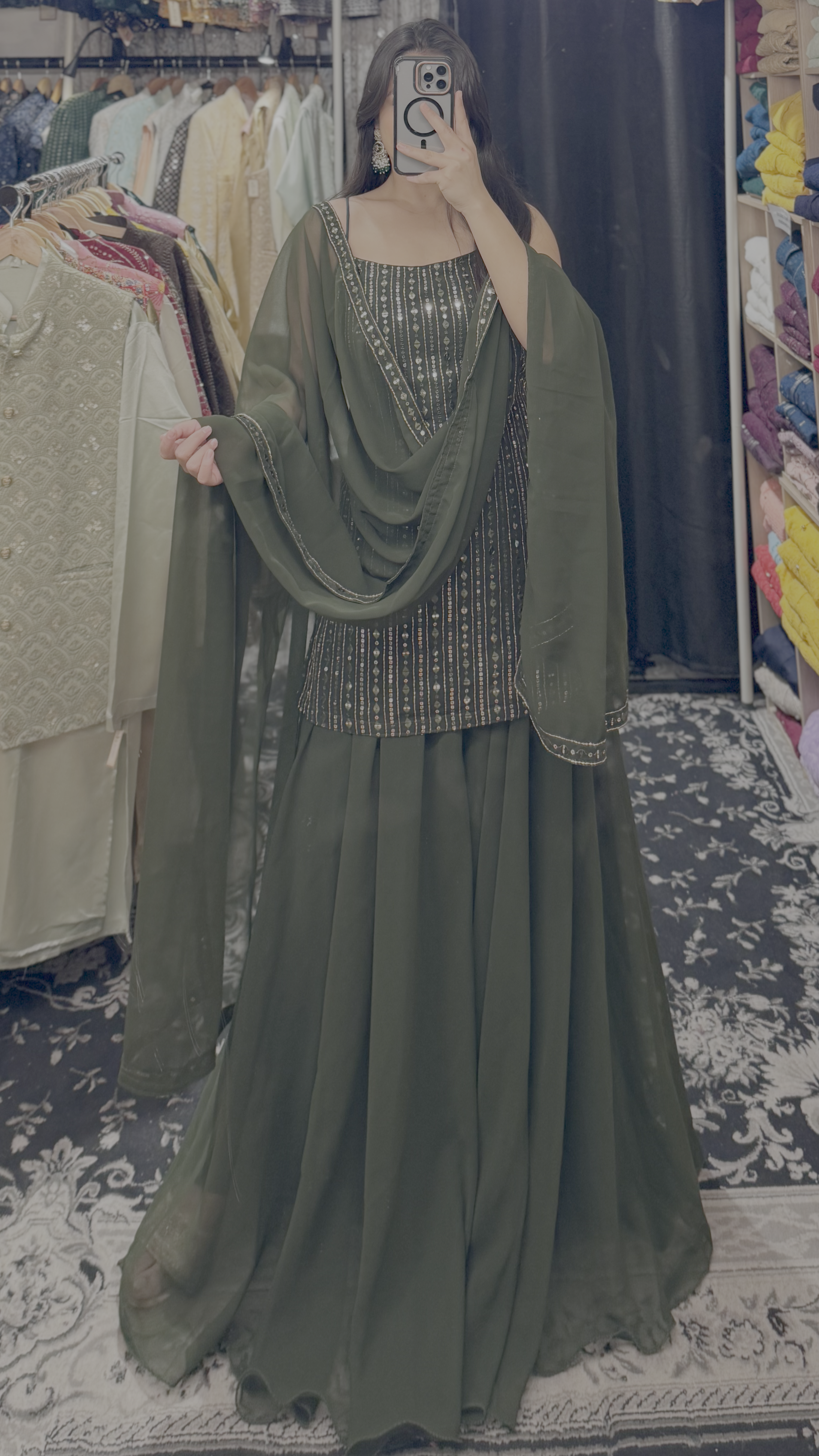 Close-up sequence embroidery detail on bottle green sharara top