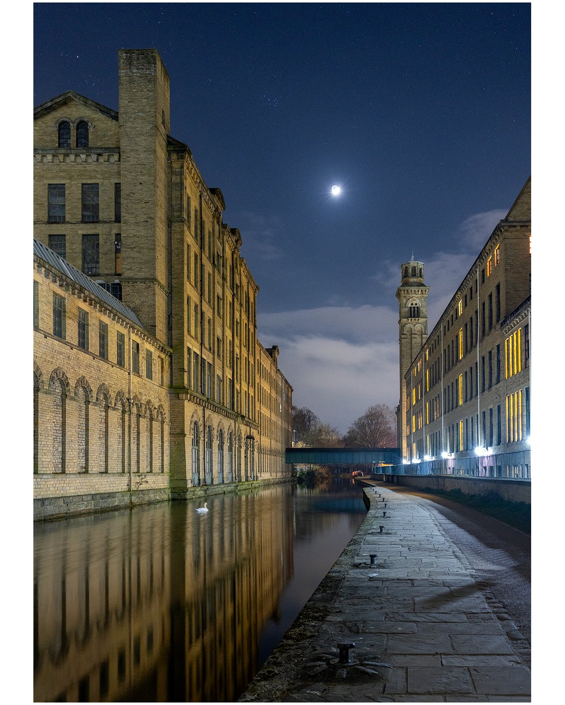 Swan by moonlight on the Leeds Liverpool Canal, Salts Mill. Taken during the last night photography session until autumn 2026. 

The high(ish) ISO and low f number (wide aperture) are primarily to help minimise the movement of the swan (shortening th