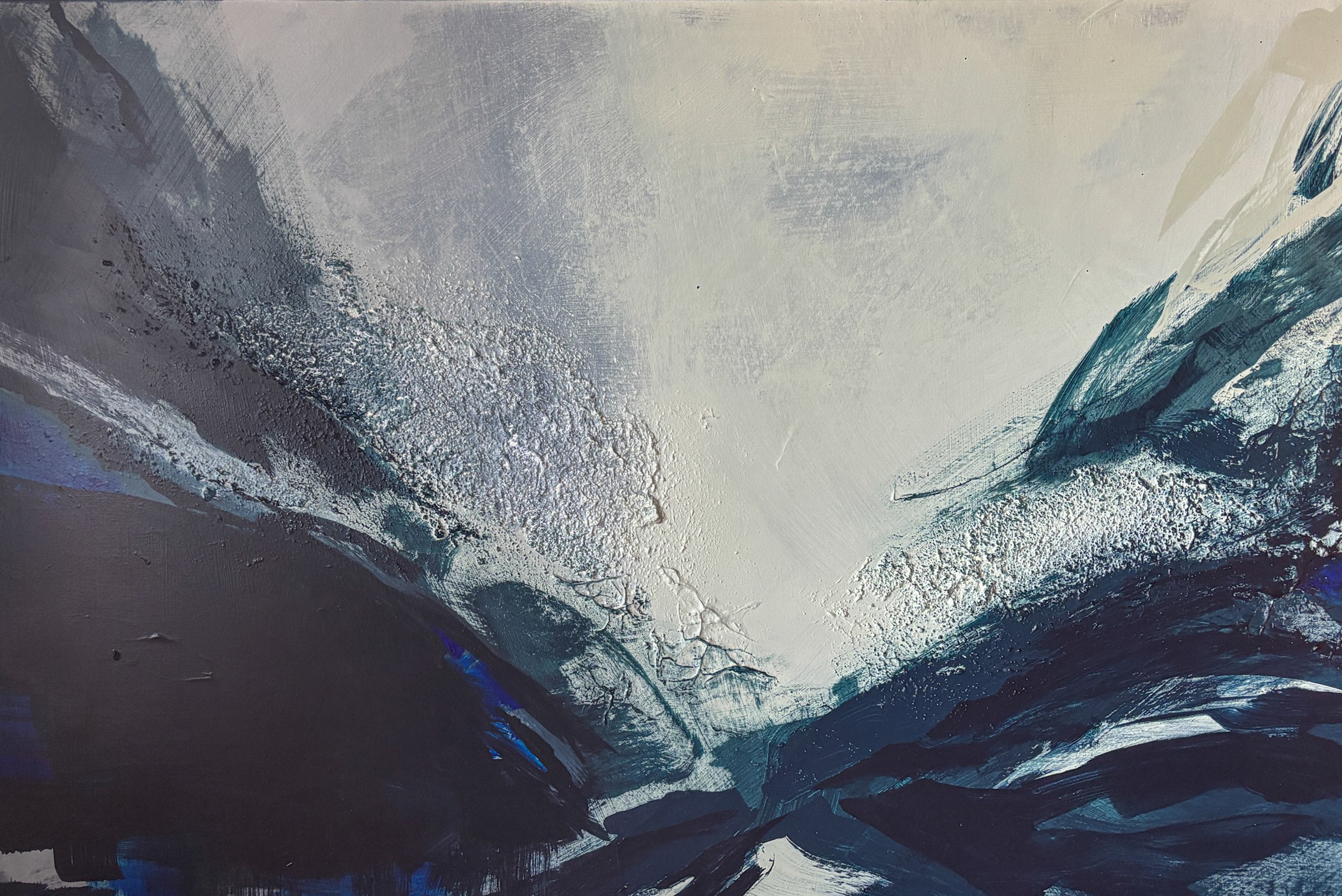 Abstract painting with dark blue, black, gray, and white textured brushstrokes resembling a mountainous landscape.